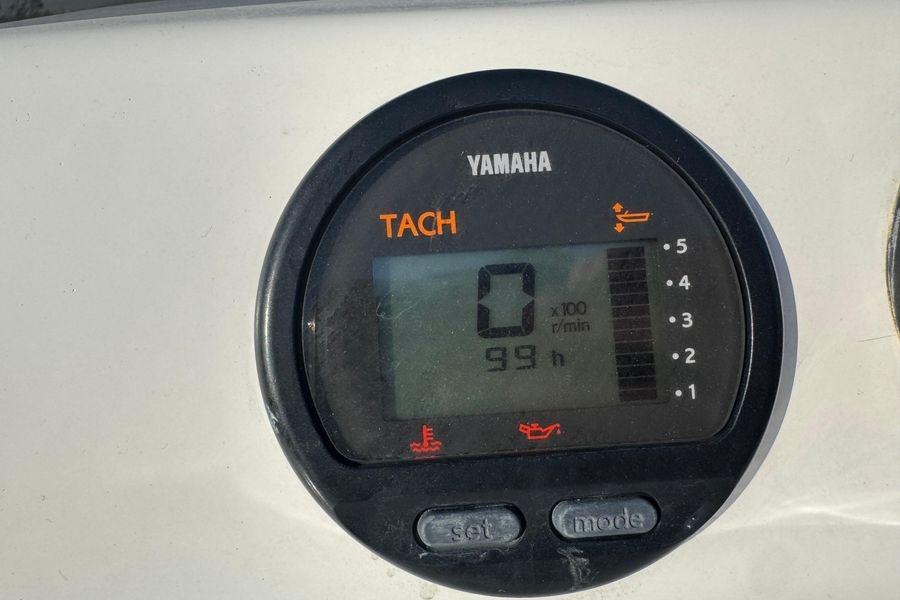 Yamaha tachometer displaying 0 RPM and 99 hours on a Viking 61 Enclosed Bridge.