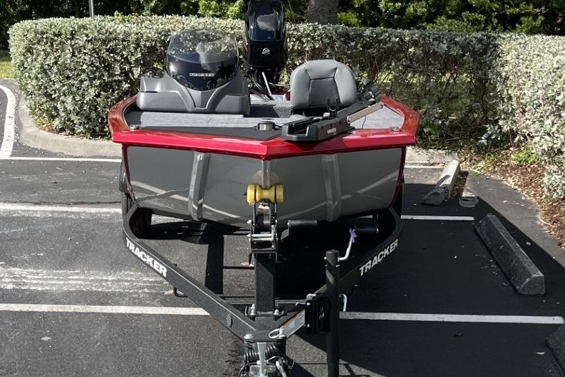 2026 Tracker Pro 170 boat on trailer in parking lot, front view.
