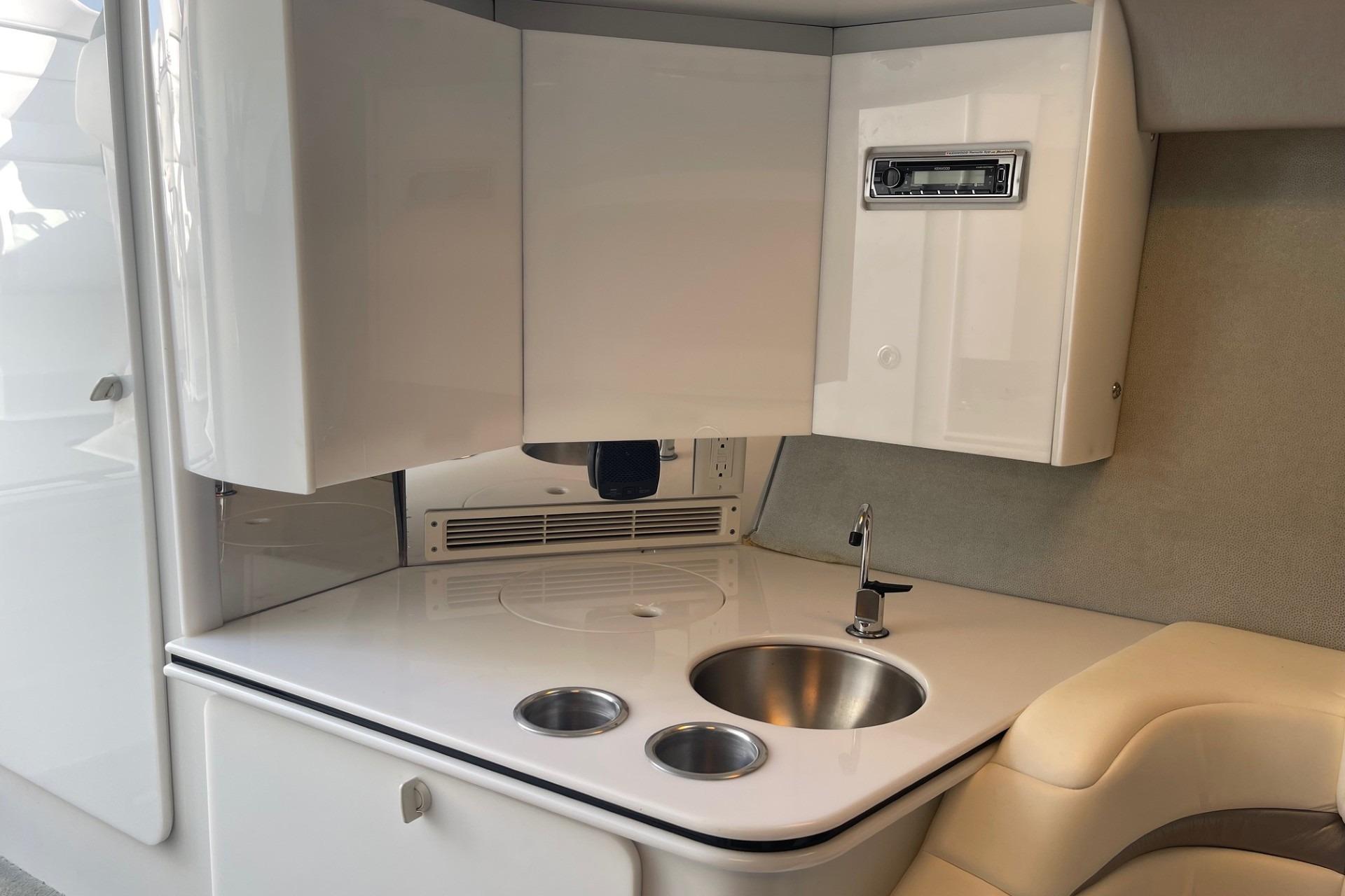 2004 Formula 382 FASTech boat interior with sleek kitchenette and modern amenities.