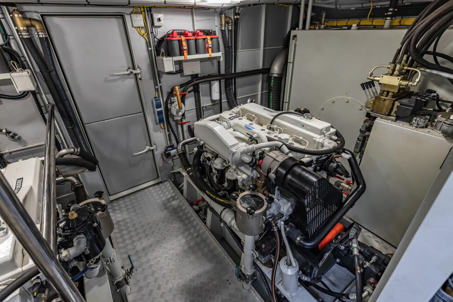 Engine room of 2013 Sturier 620 OC yacht, featuring modern machinery and equipment.