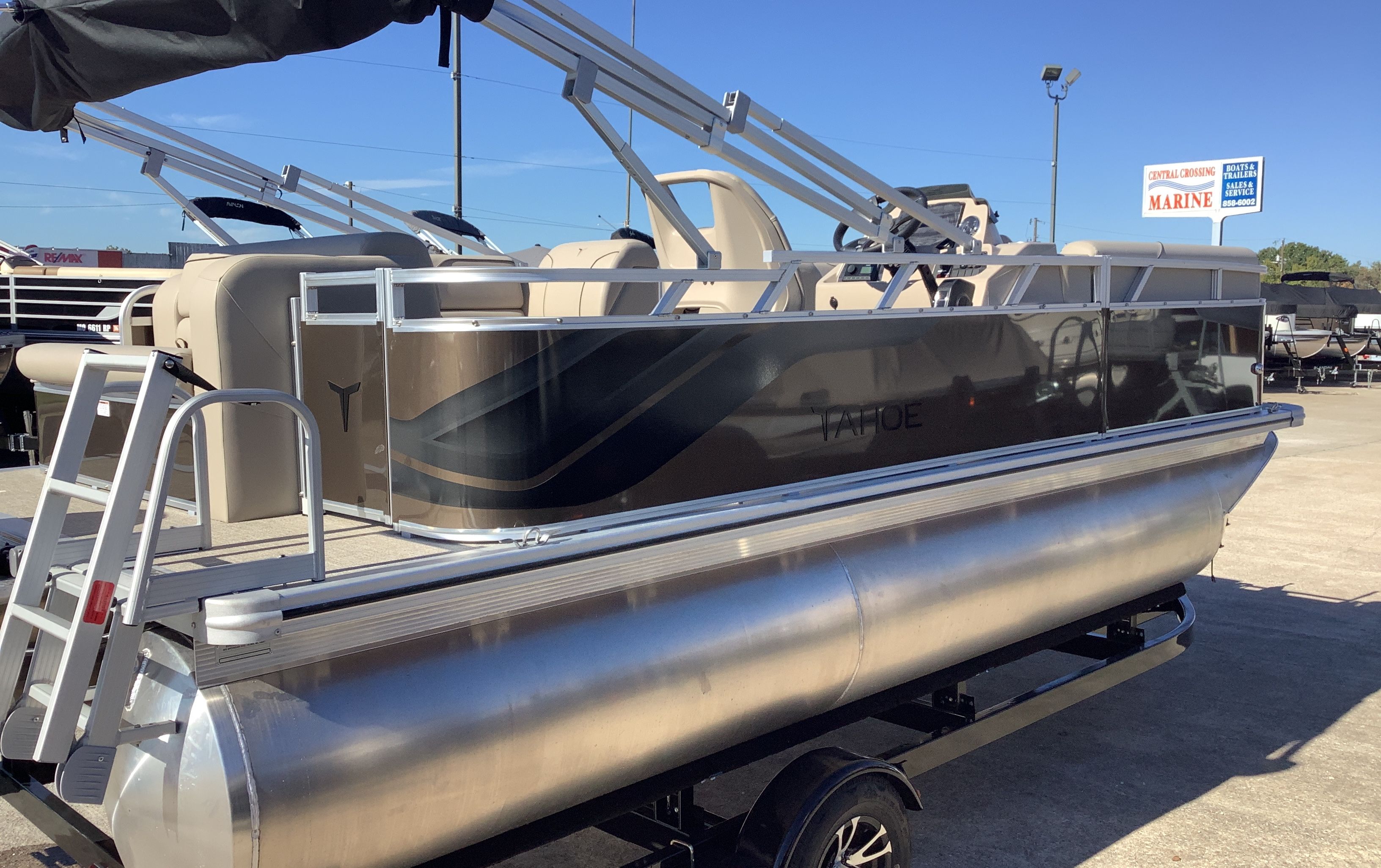 2026 Tahoe 1980 Sport Cruise pontoon boat with rear bench on trailer.