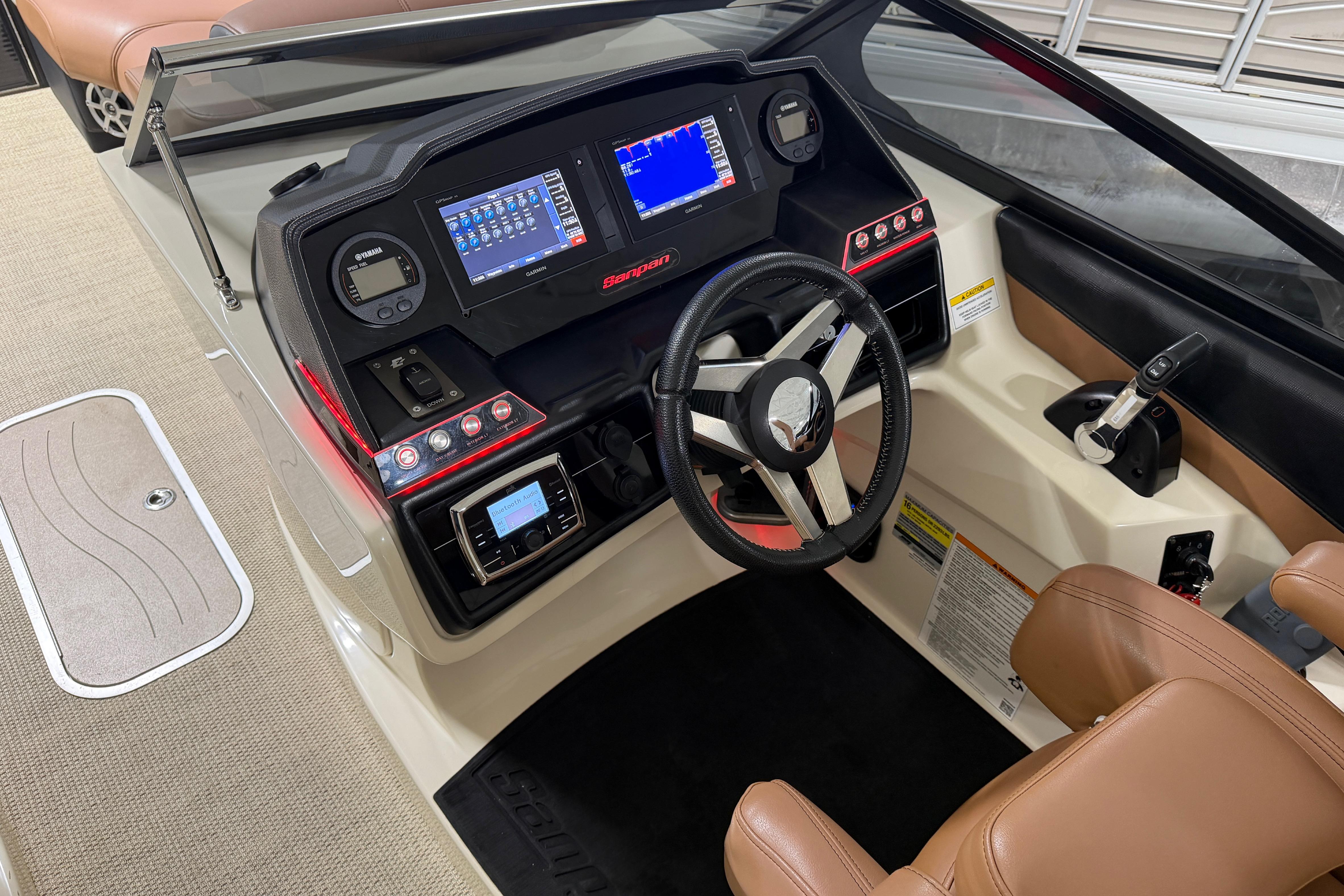 2018 Godfrey Sanpan 2500 ULC boat dashboard with modern controls and steering wheel.