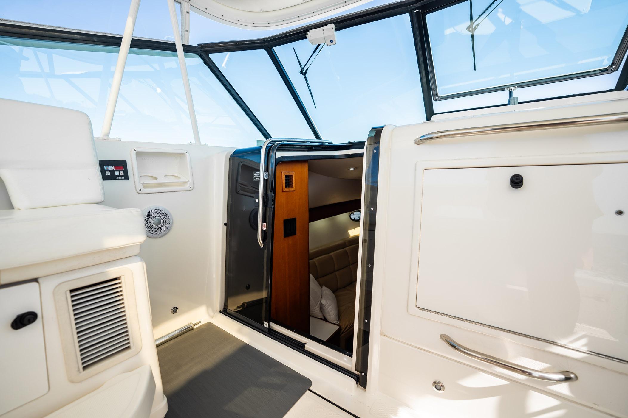 2002 Tiara Yachts 4100 Open interior view, showcasing cabin entrance and seating area.
