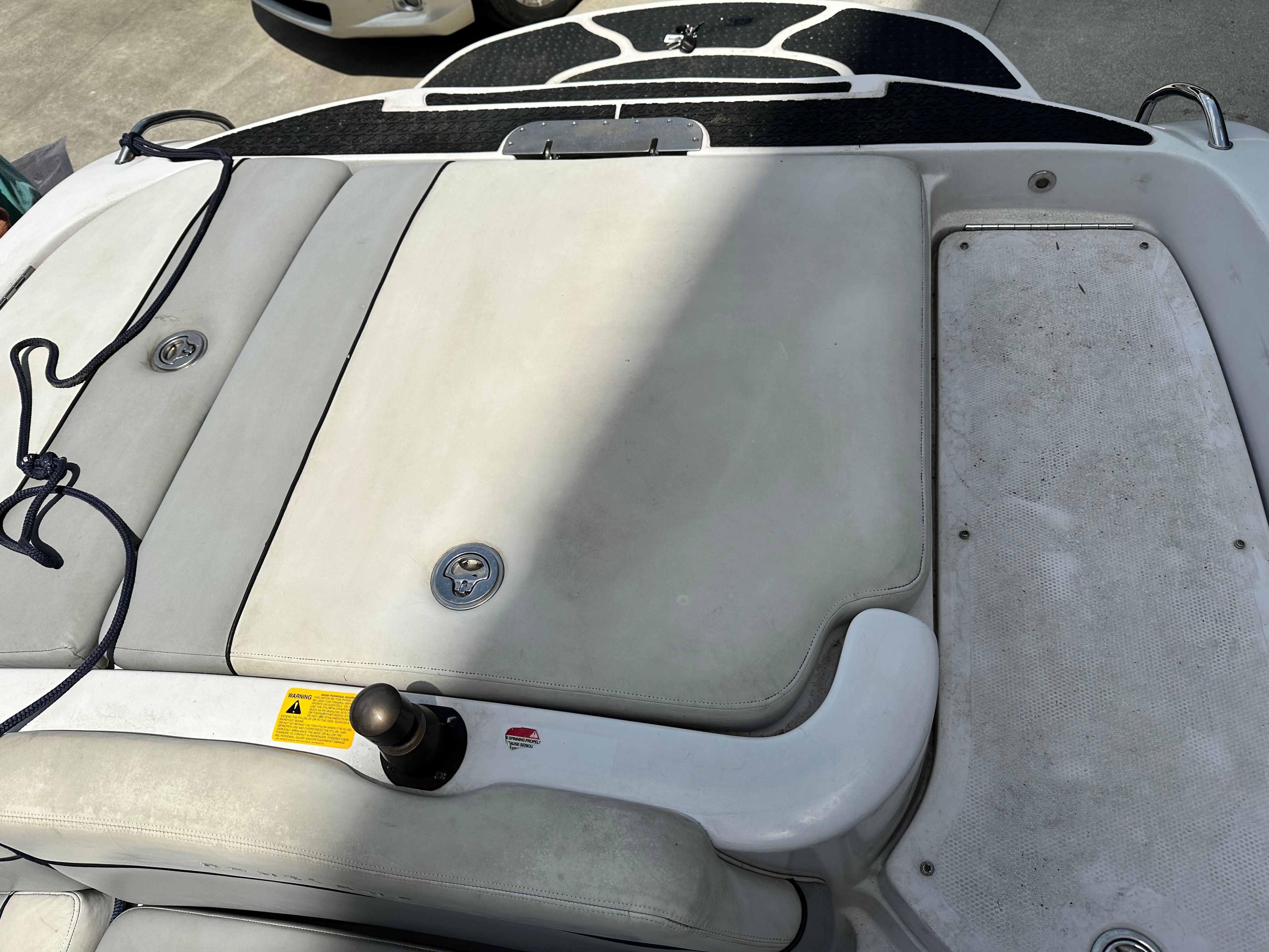Rear view of a 2007 Nautique SV 211 with gray upholstery and black deck.