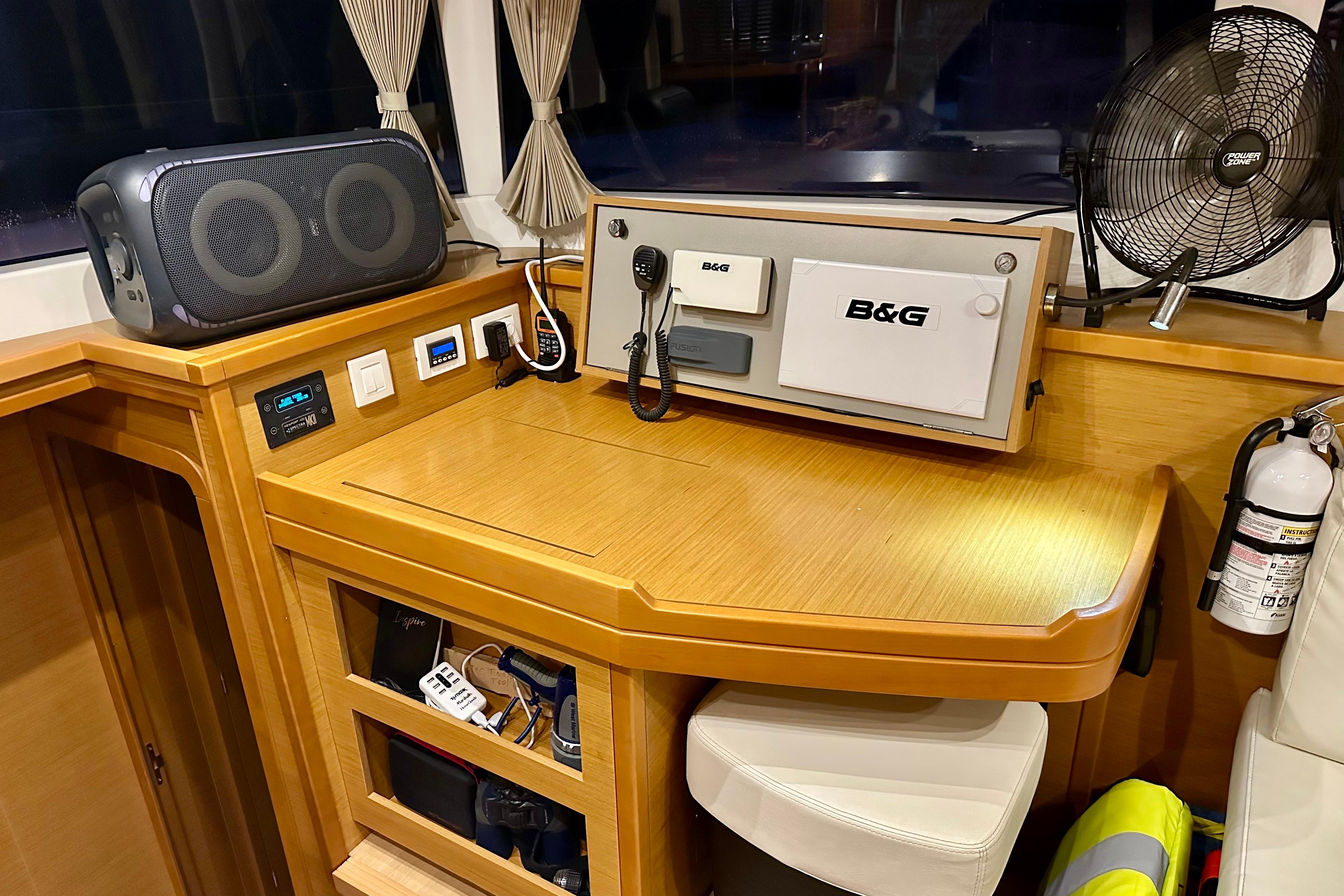 Navigation station on 2016 Lagoon 450 S catamaran with B&G equipment and safety gear.