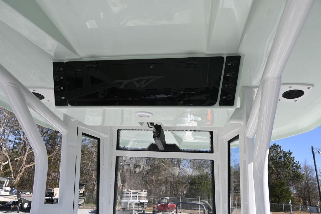 2026 Tidewater 2500 Carolina Bay boat interior with control panel and windows.