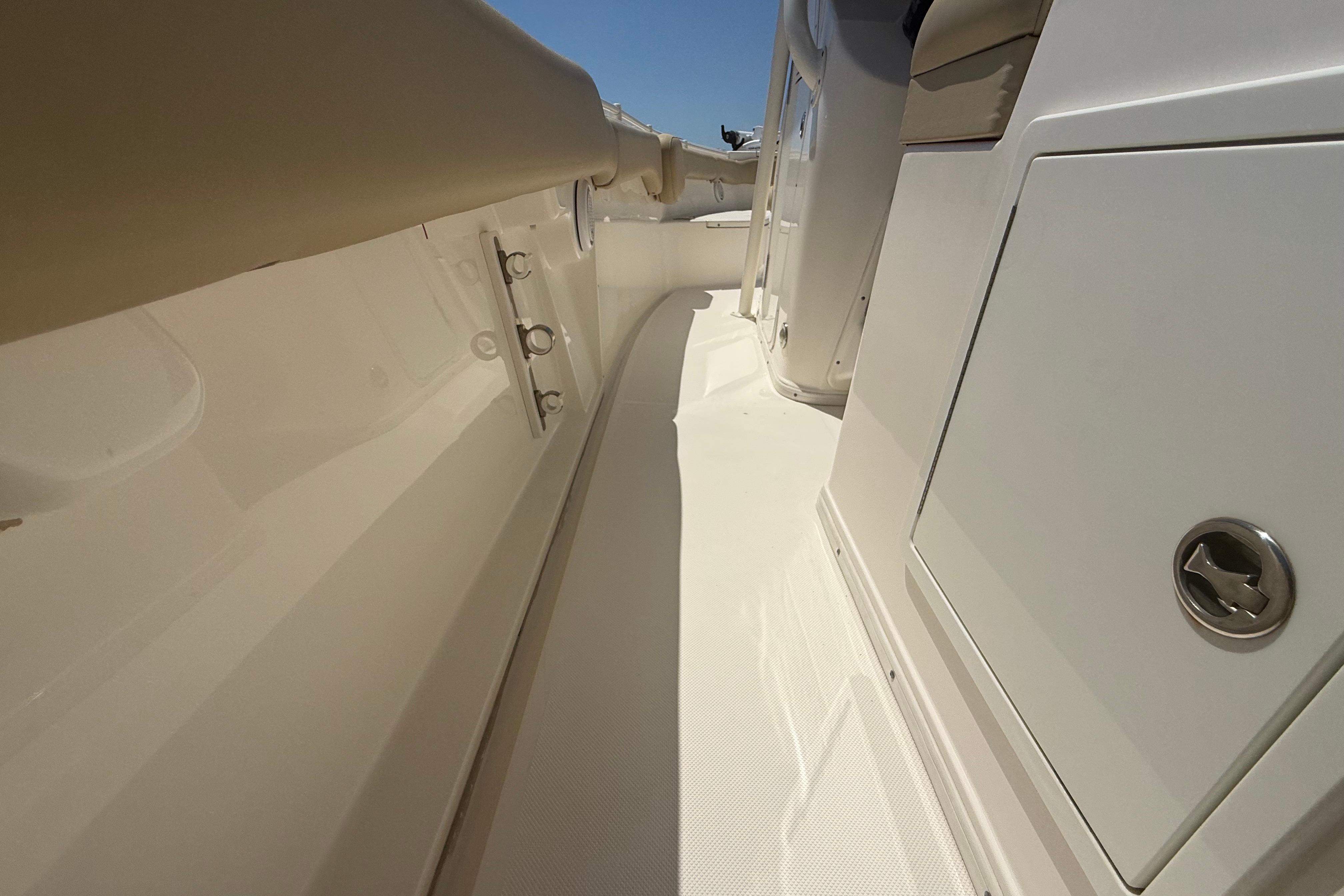 2019 Key West Billistic 281 Center Console boat interior, featuring sleek white design and storage compartments.