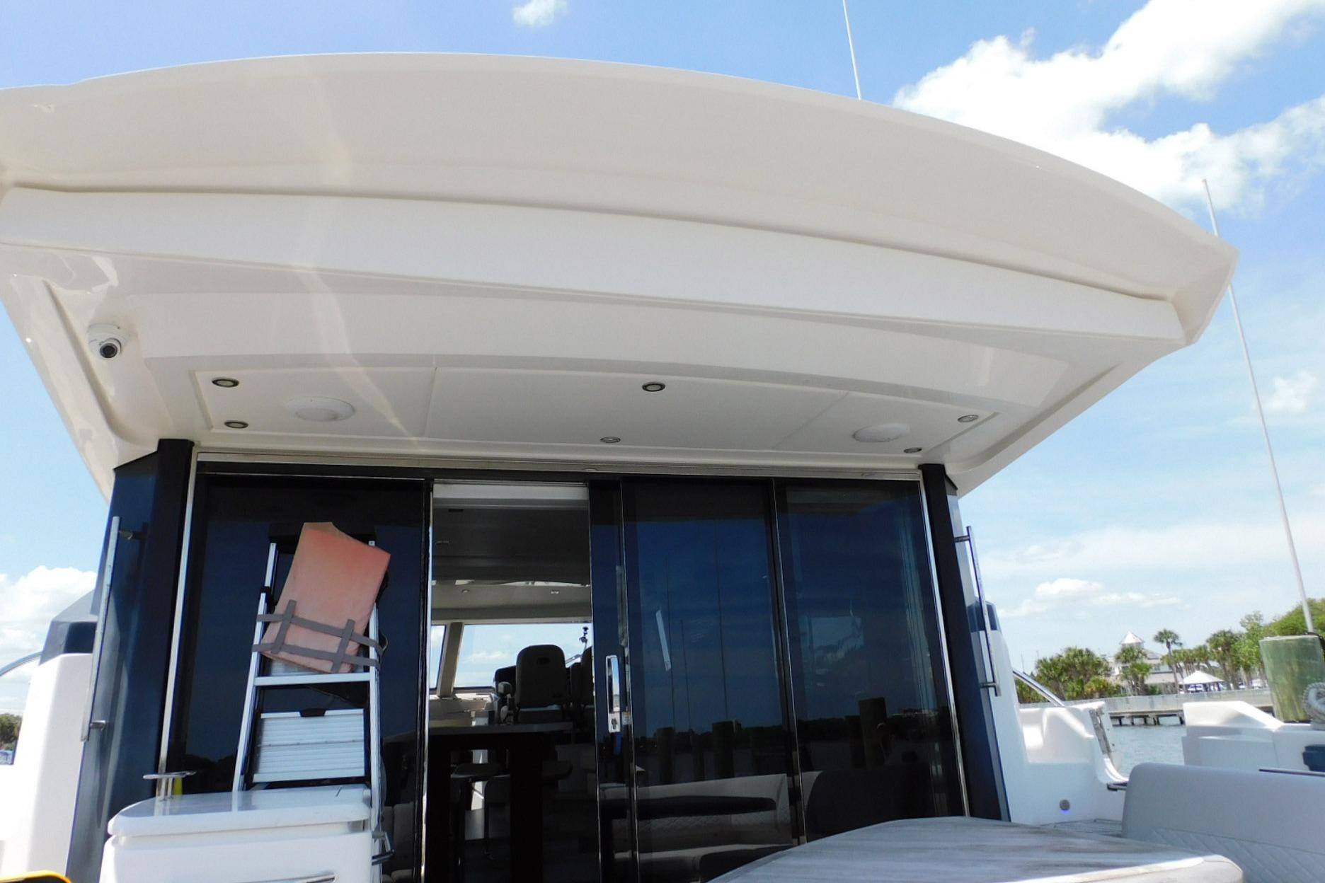 2019 Sea Ray L550 yacht with sleek exterior and spacious deck under clear skies.