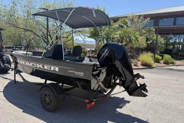 2026 Tracker Pro Guide V-16 SC boat with canopy and Mercury outboard motor.
