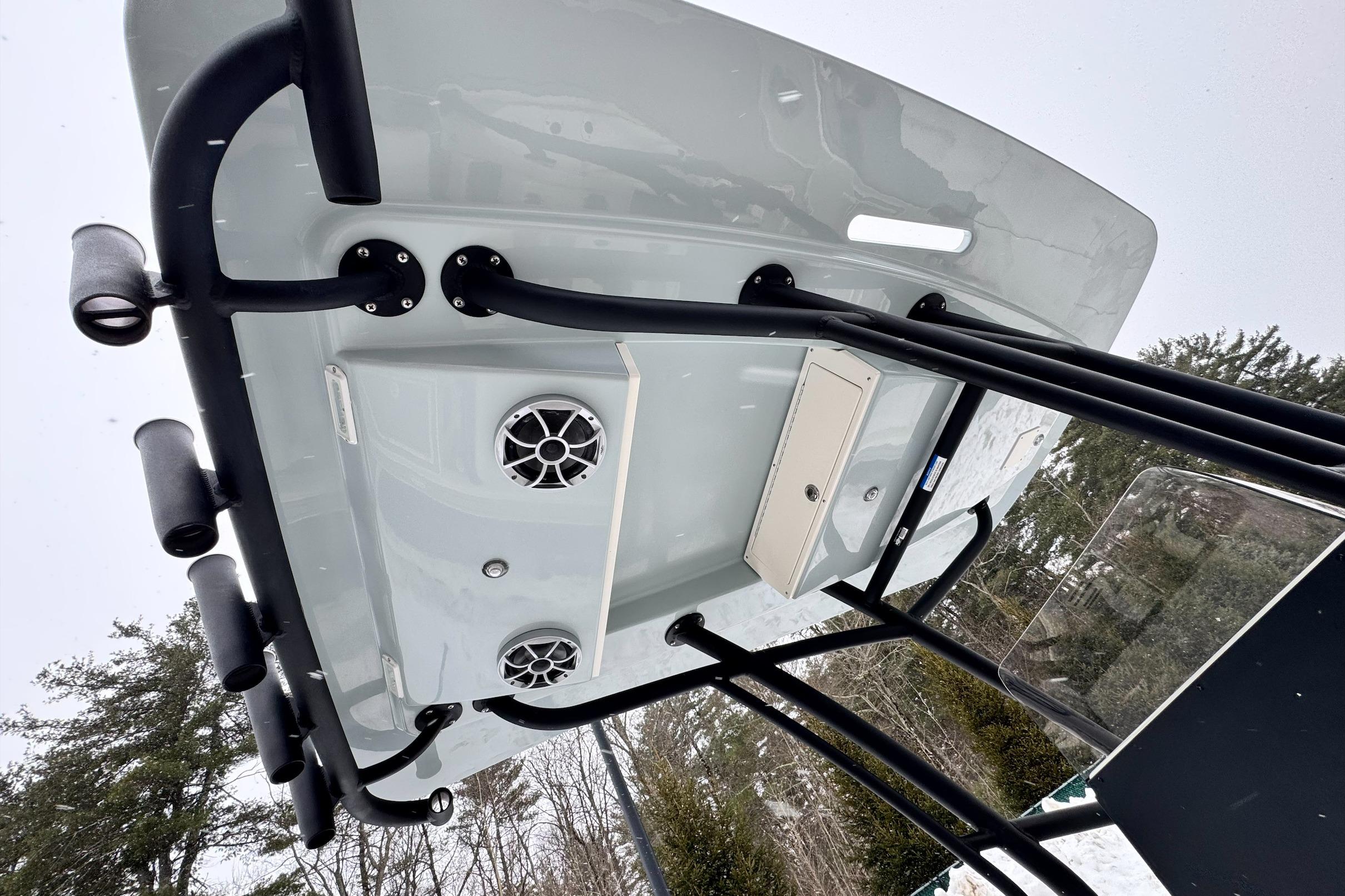 2026 Mako 24 APEX boat T-top with rod holders and speakers, viewed from below.