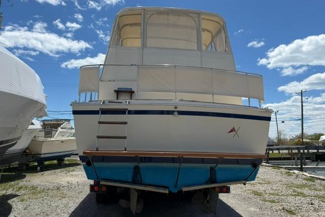 1980 Chris-Craft 381 Catalina boat on trailer under a clear blue sky.