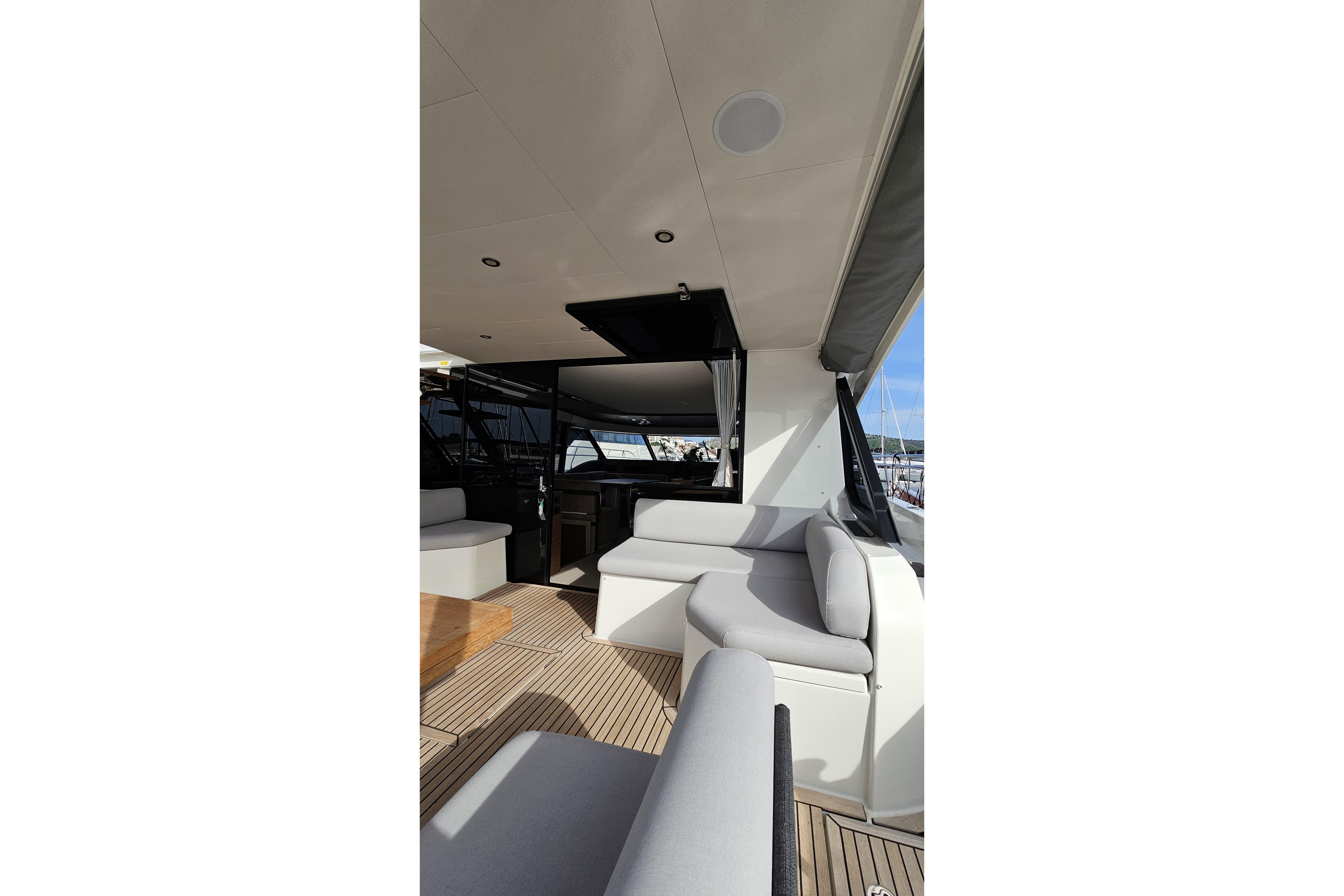 Luxurious interior of 2024 Prestige M48 yacht with modern seating and sleek design.