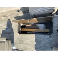 2025 Ranger Reata 223FC boat storage compartment with wooden flooring.
