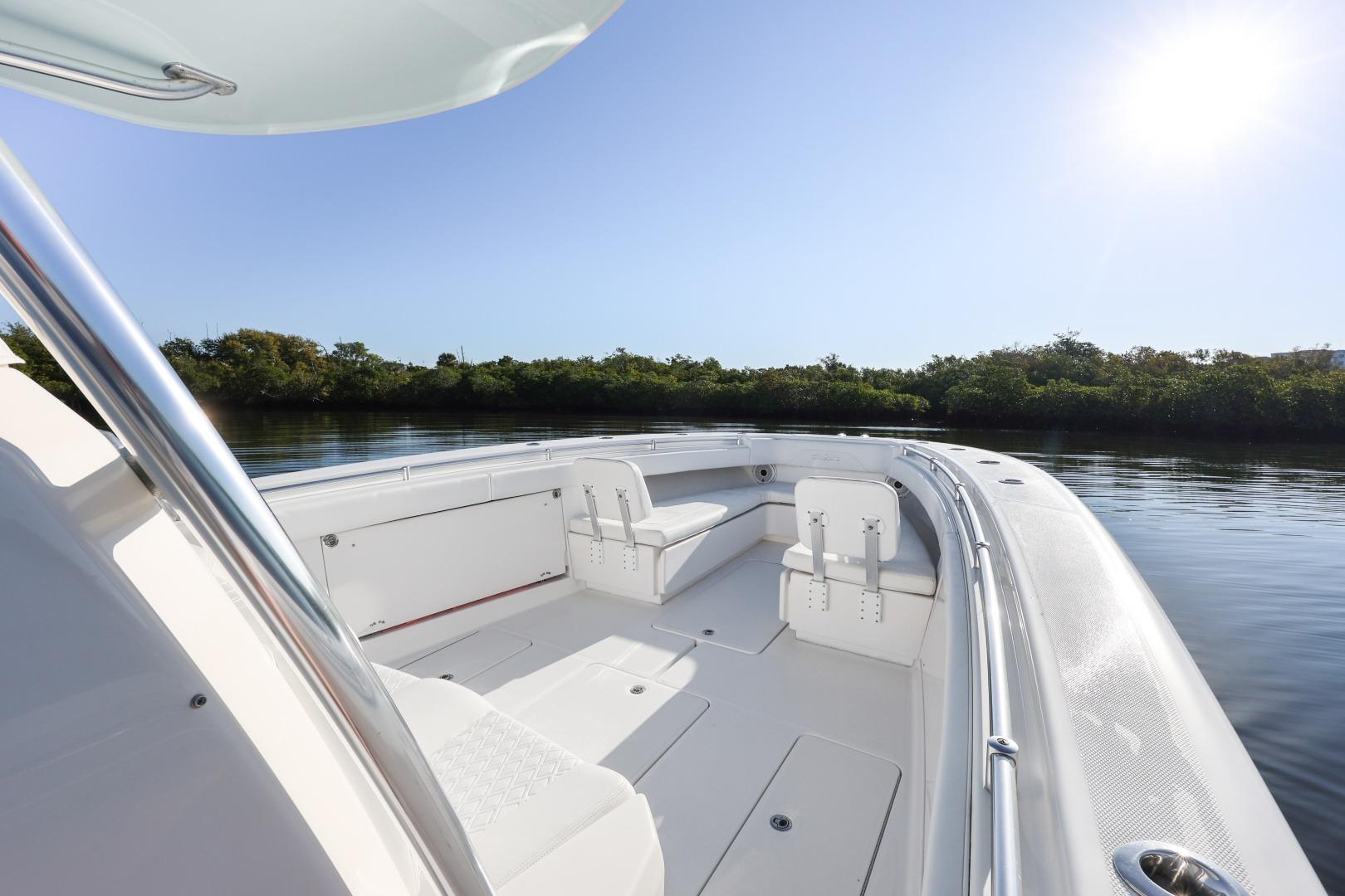 2016 Invincible 39 Open Fisherman boat on calm water, sunny day.