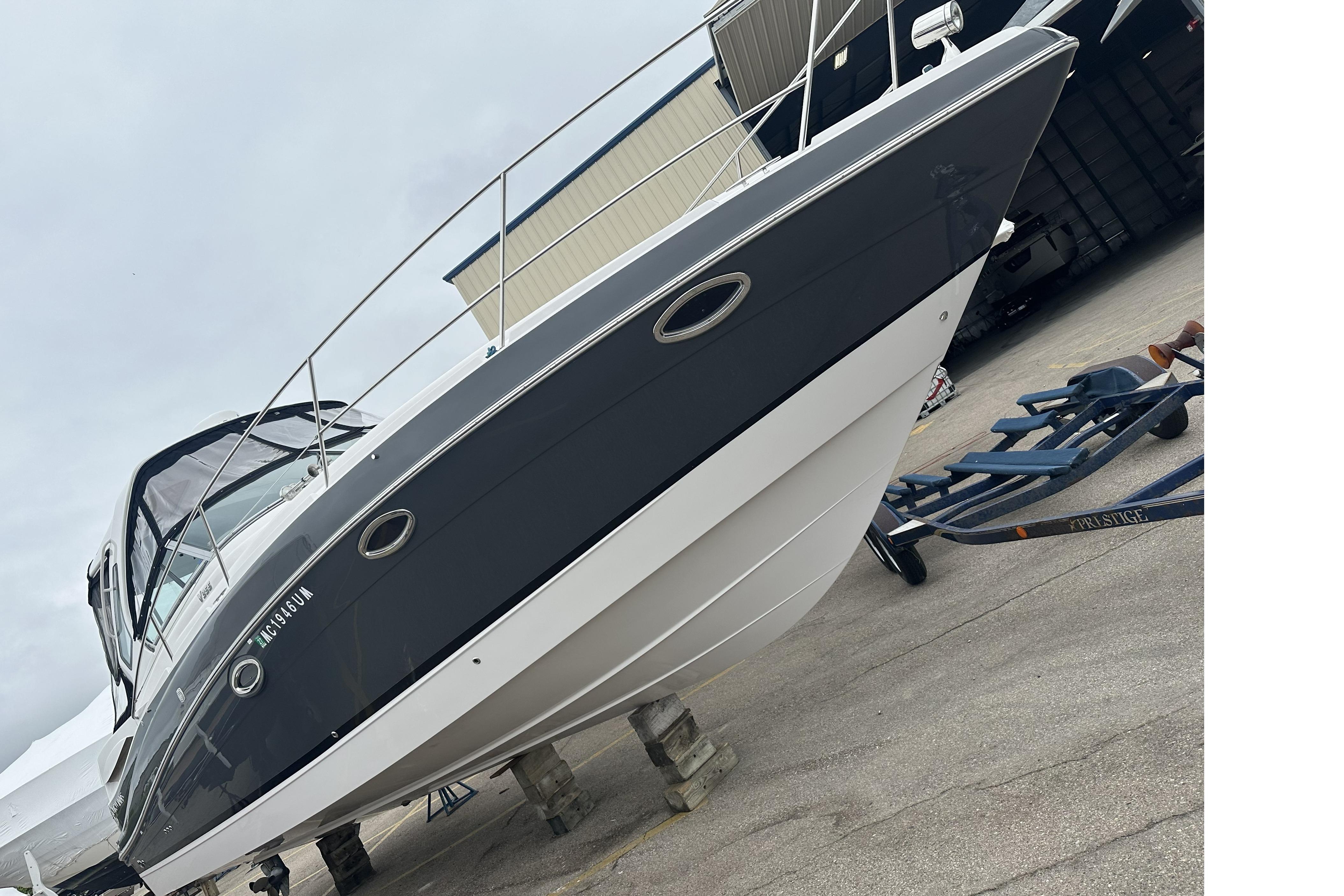 2018 Four Winns V355 boat on trailer, displayed outdoors.
