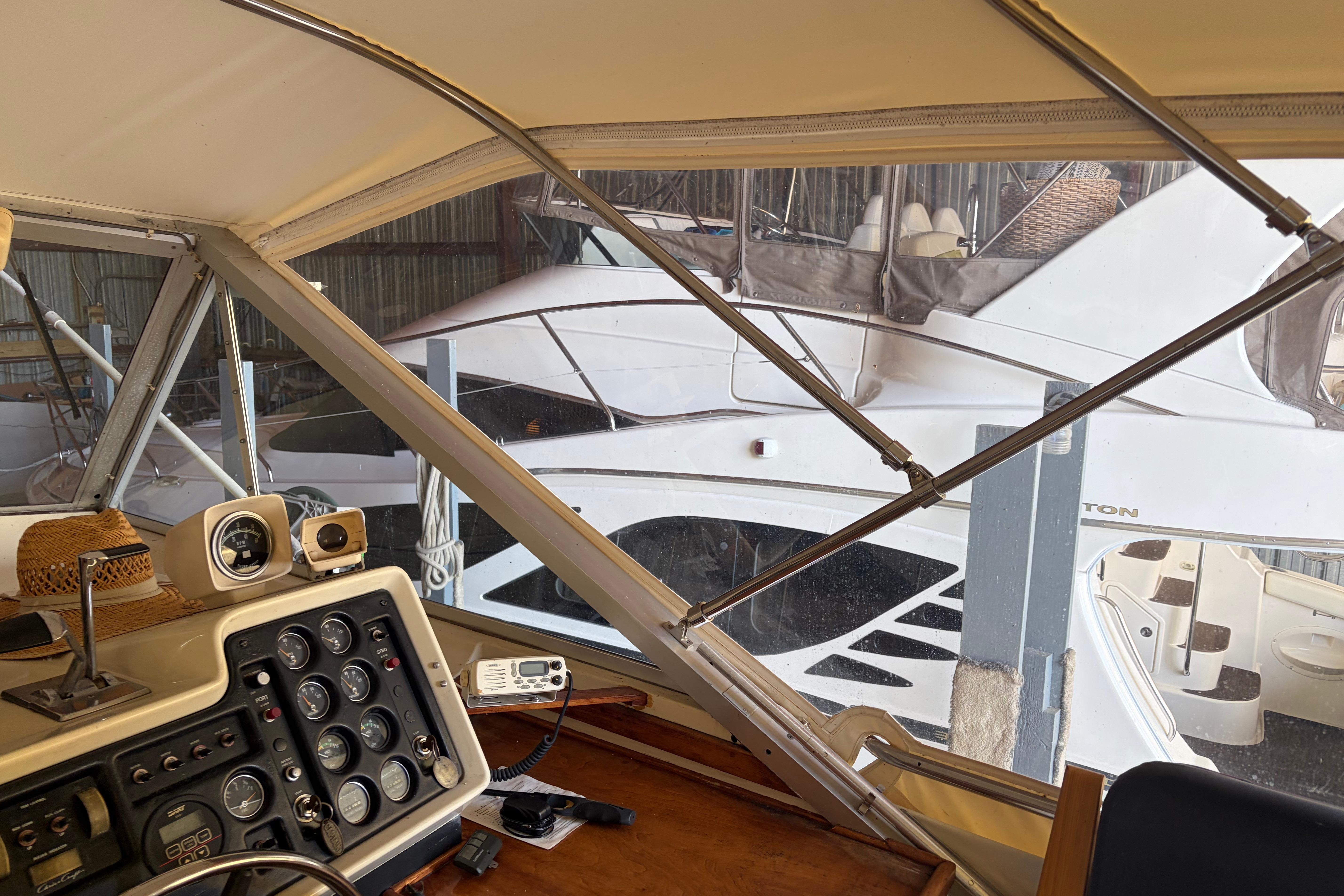 Interior view of a 1971 Chris-Craft 42 Commander yacht with dashboard controls.