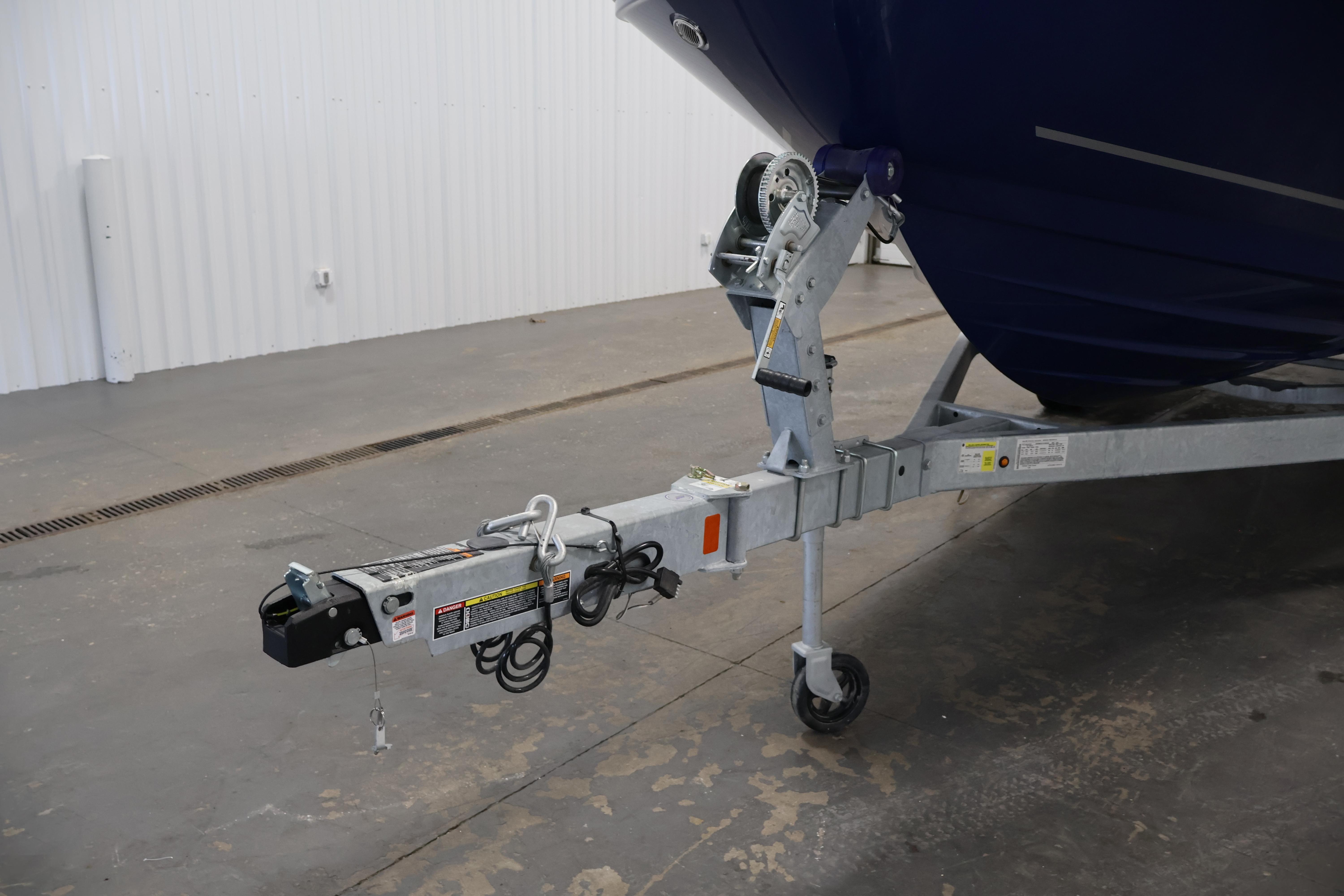 2026 Bayliner VR6 Bowrider I/O on trailer, showcasing hitch and front wheel.