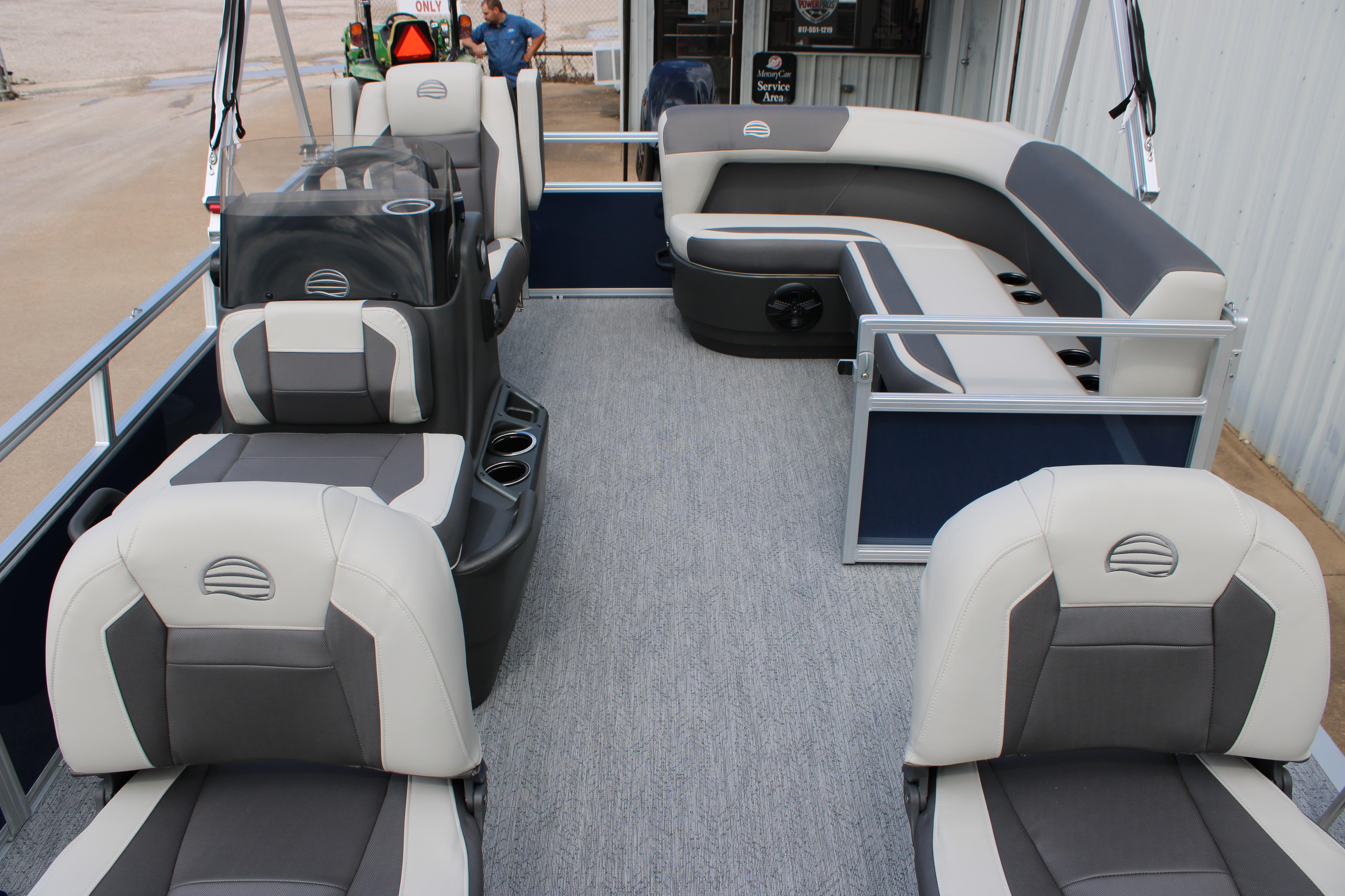 2026 Sun Tracker Bass Buggy 16 XL Select pontoon boat interior with gray and white seating.