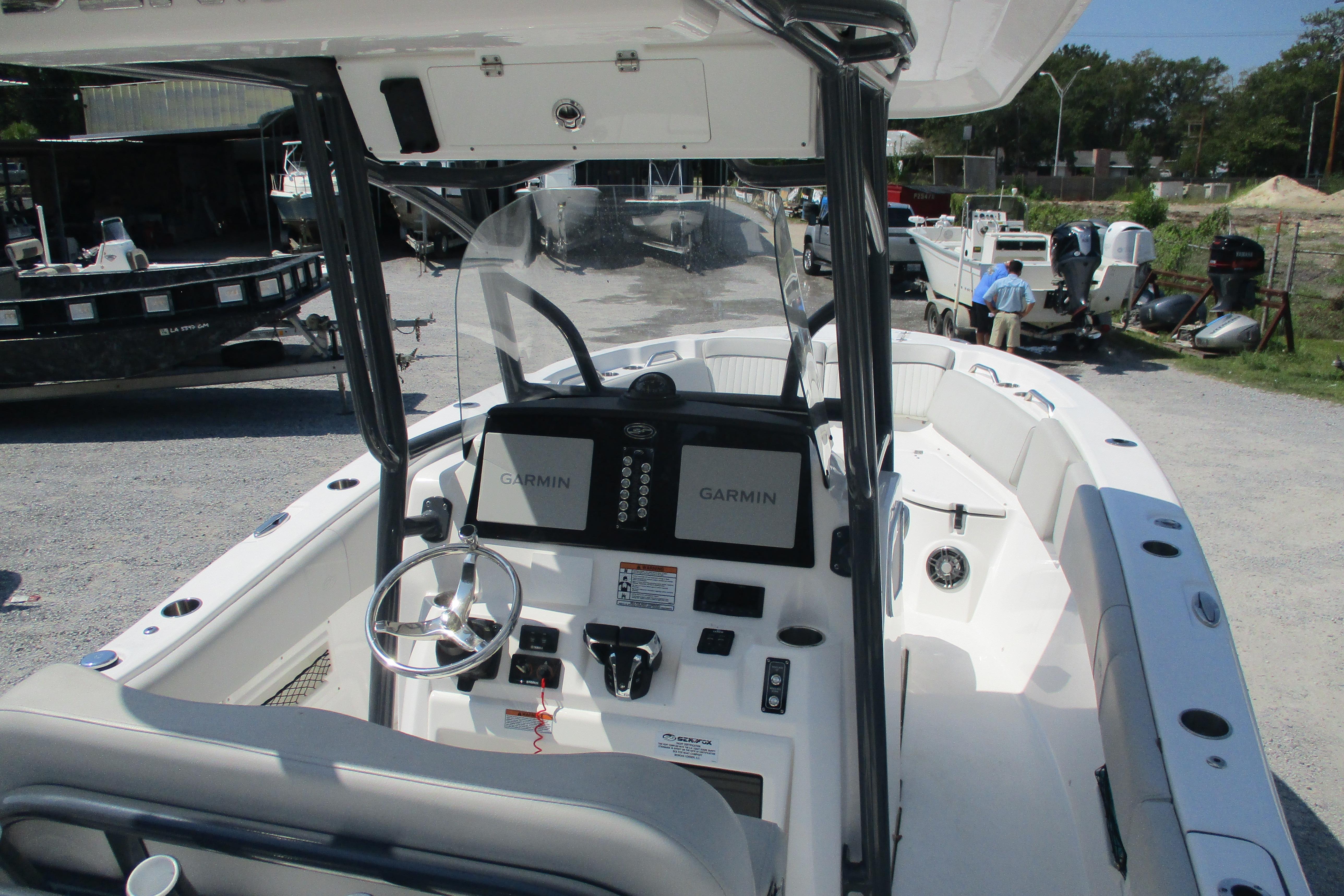 2024 Sea Fox 268 Commander boat interior with Garmin navigation system and steering wheel.