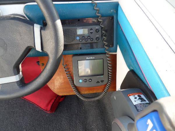 1992 Rinker Captiva 170 OB dashboard with steering wheel, radio, and navigation equipment.