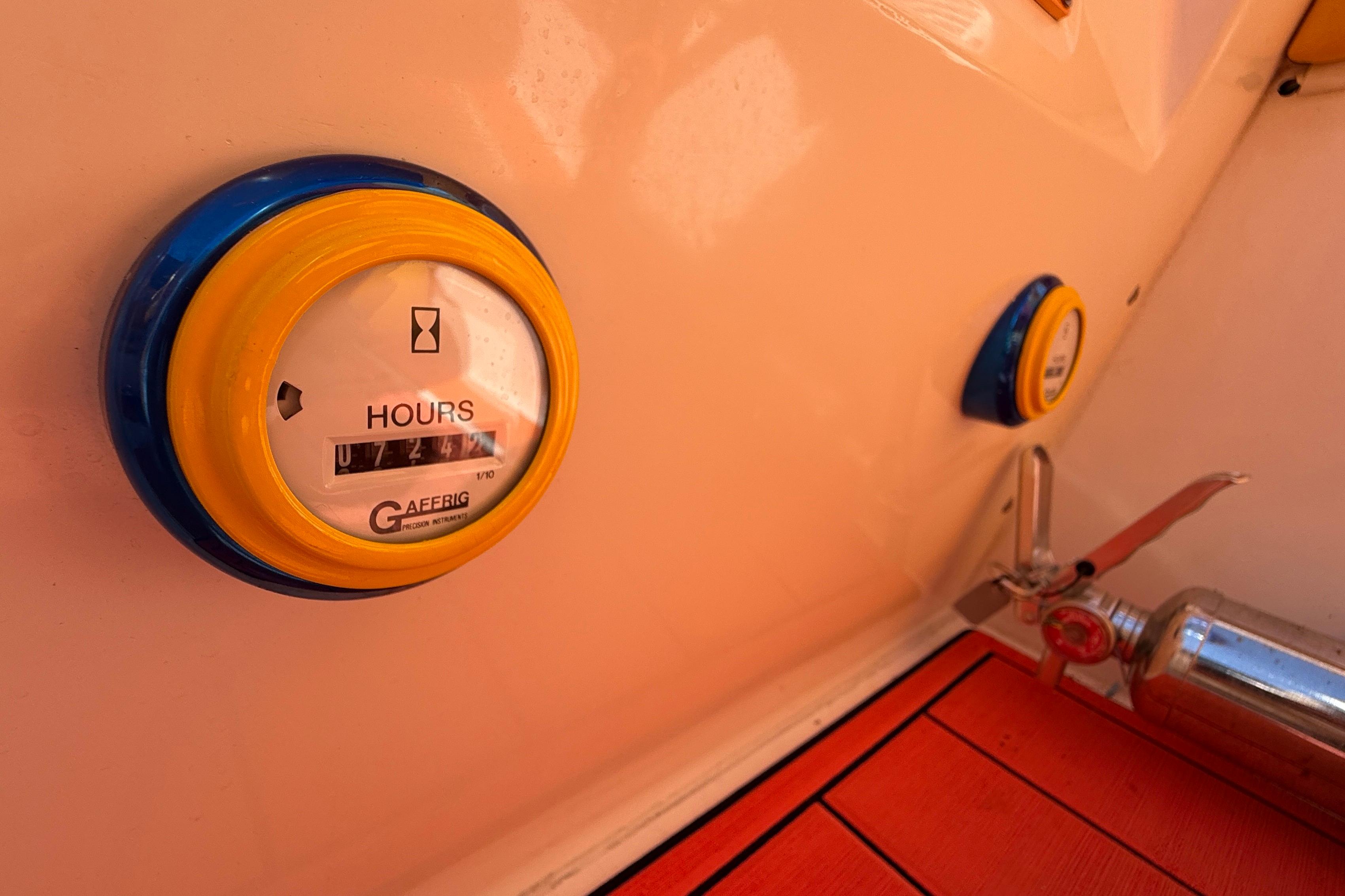 Hour meter and fire extinguisher on 2002 Cigarette 35' Cafe Racer boat.