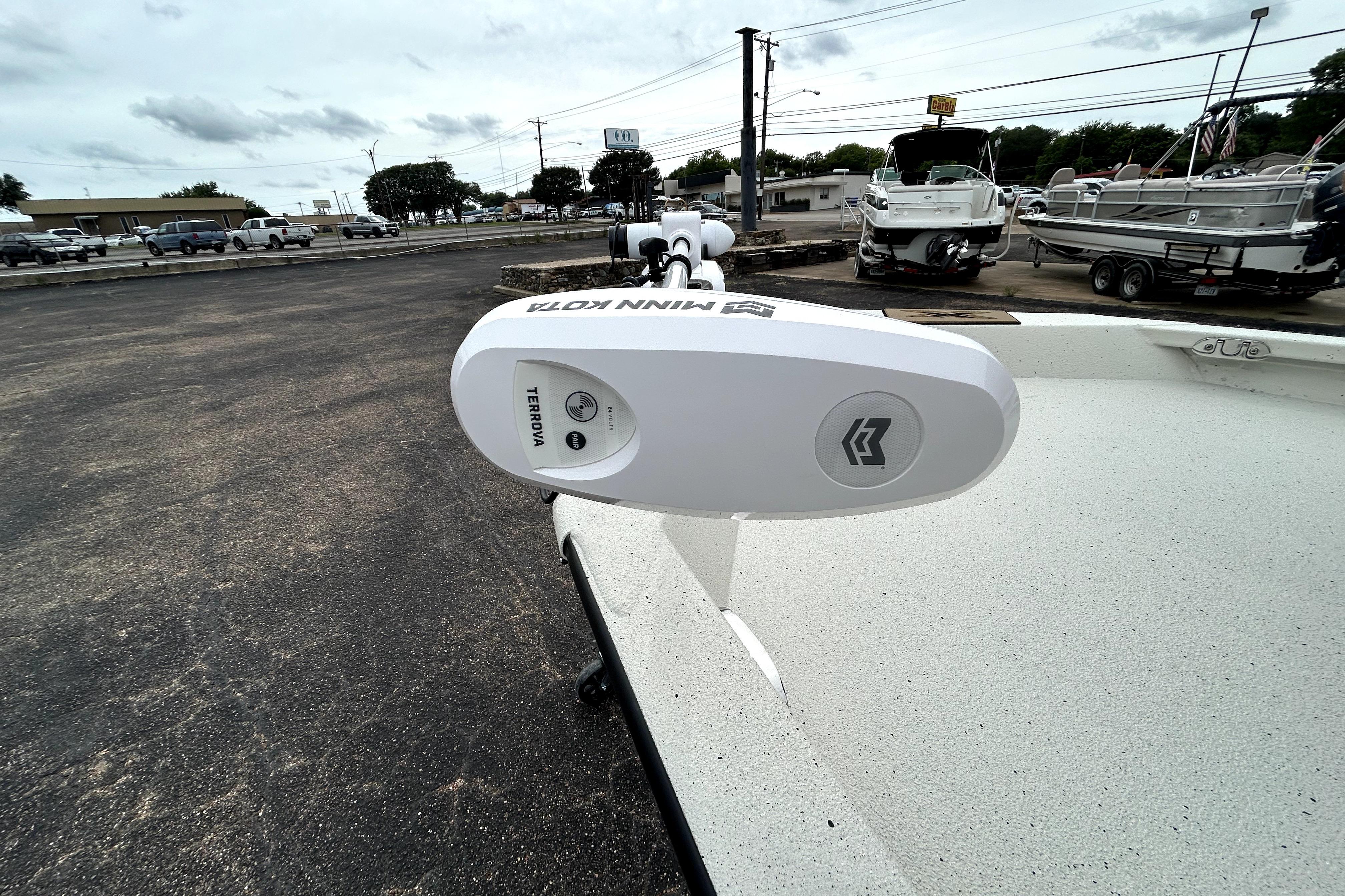 2026 Xpress H20B Bay boat with Minn Kota Terrova trolling motor in a dealership lot.