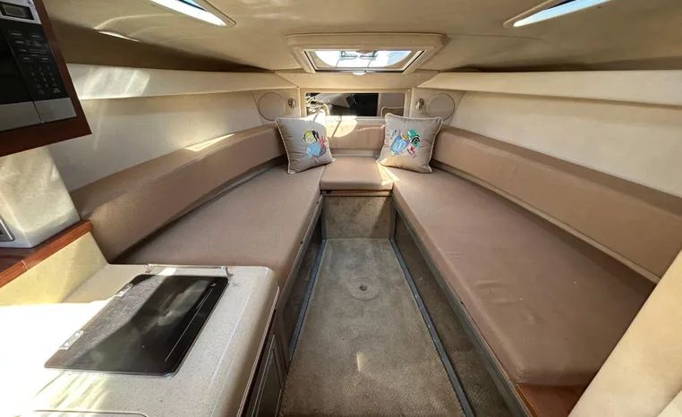 Interior of a 2010 Sea Ray Sundancer 260 with beige upholstery.