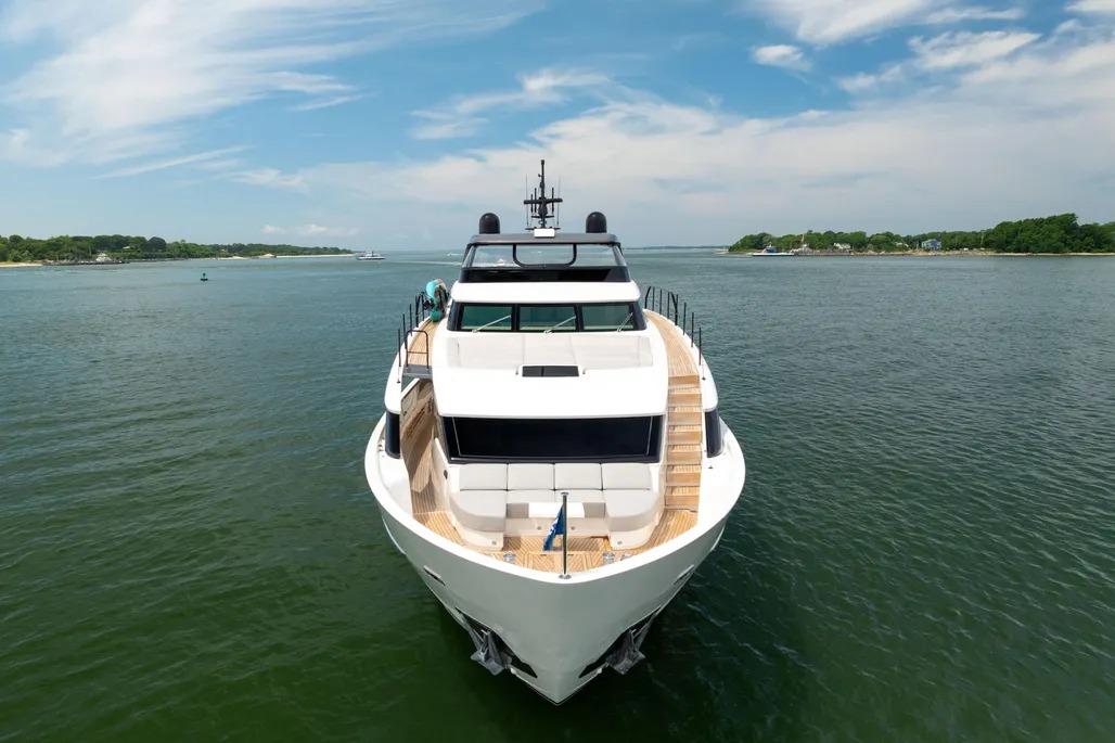 2024 Sanlorenzo SL90A yacht on calm water under blue sky.