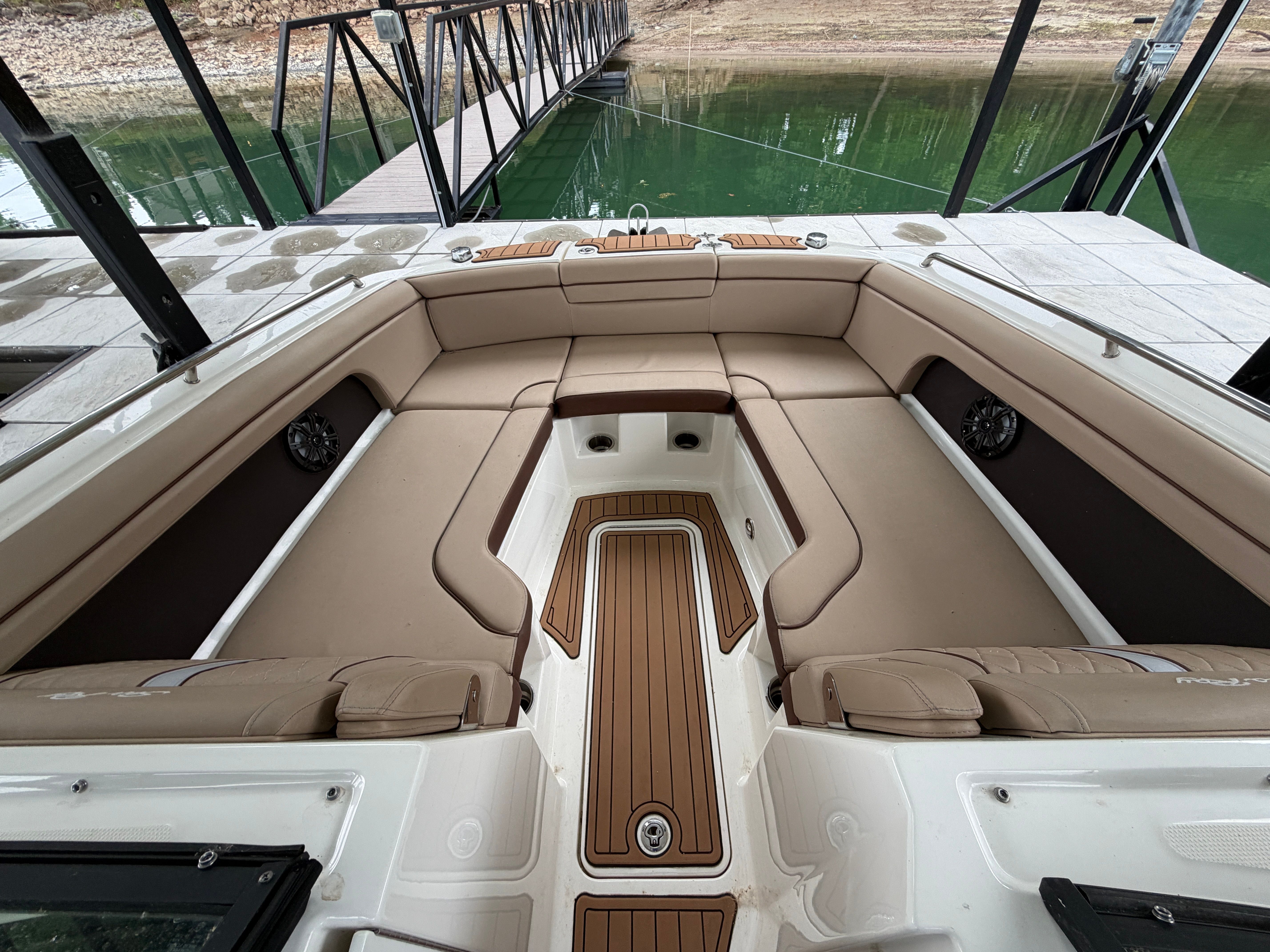 Interior of a 2016 Sea Ray 290 Sundeck with beige seating.