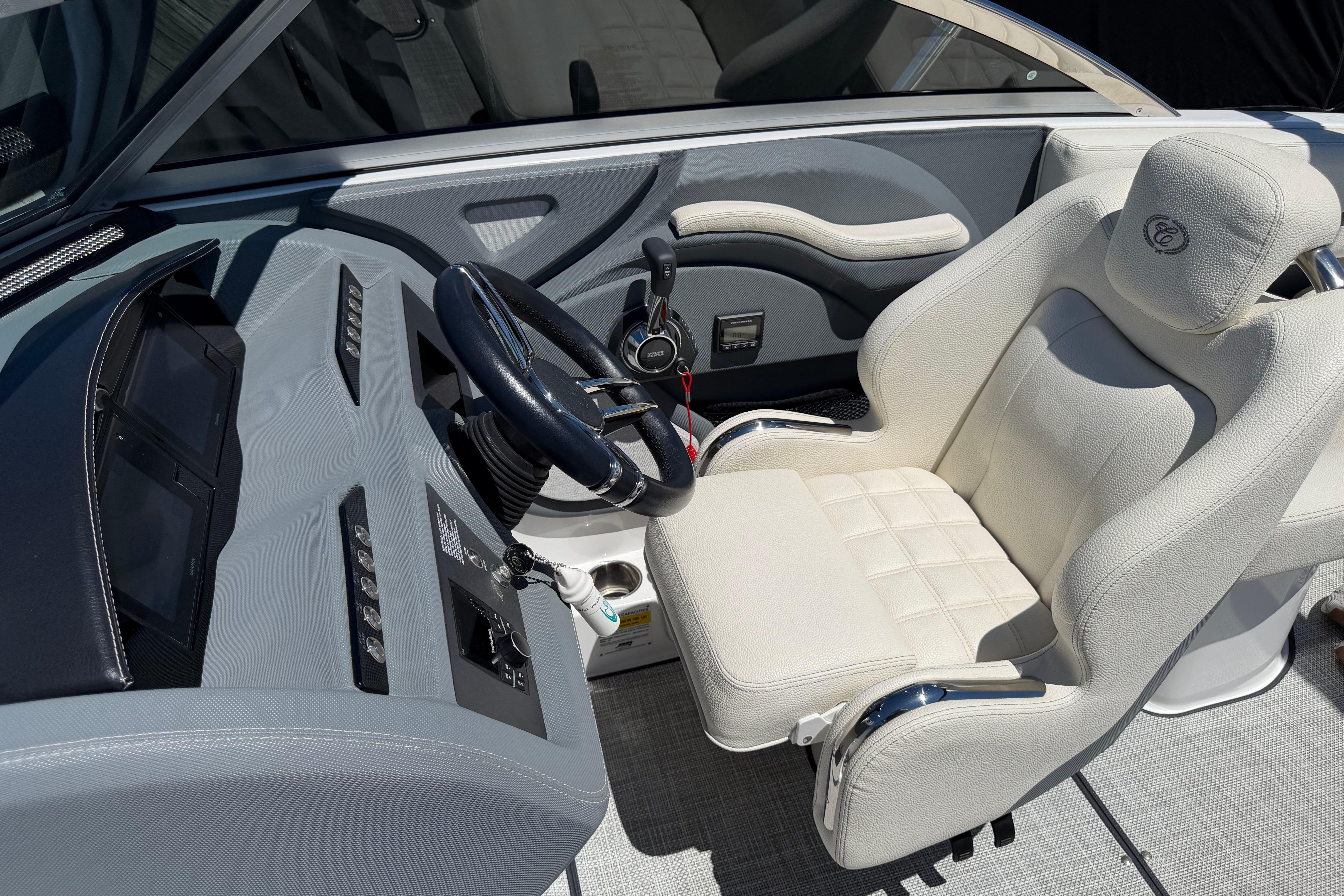 Interior of a 2020 Cobalt R3 boat featuring a sleek steering console and plush seating.