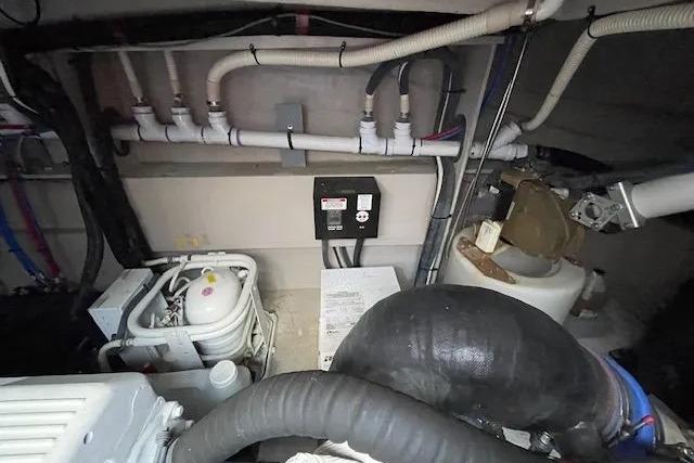 Engine room of 2016 Sea Ray Sundancer 510 with visible mechanical components.