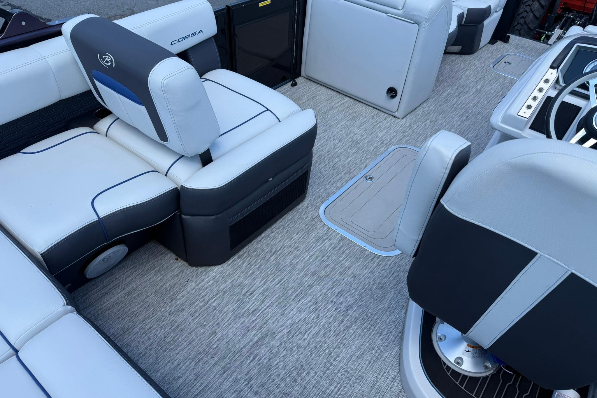 2023 Barletta Corsa 23U boat interior with modern seating and steering area.