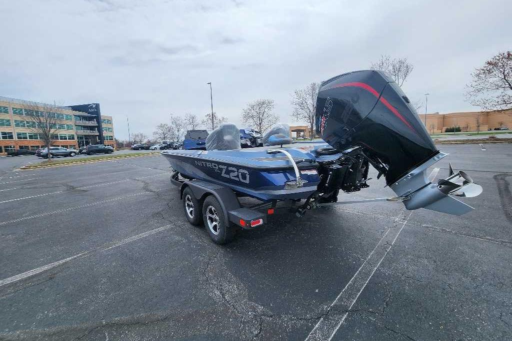 2026 Nitro Z20 XL boat with powerful outboard motor in a parking lot.