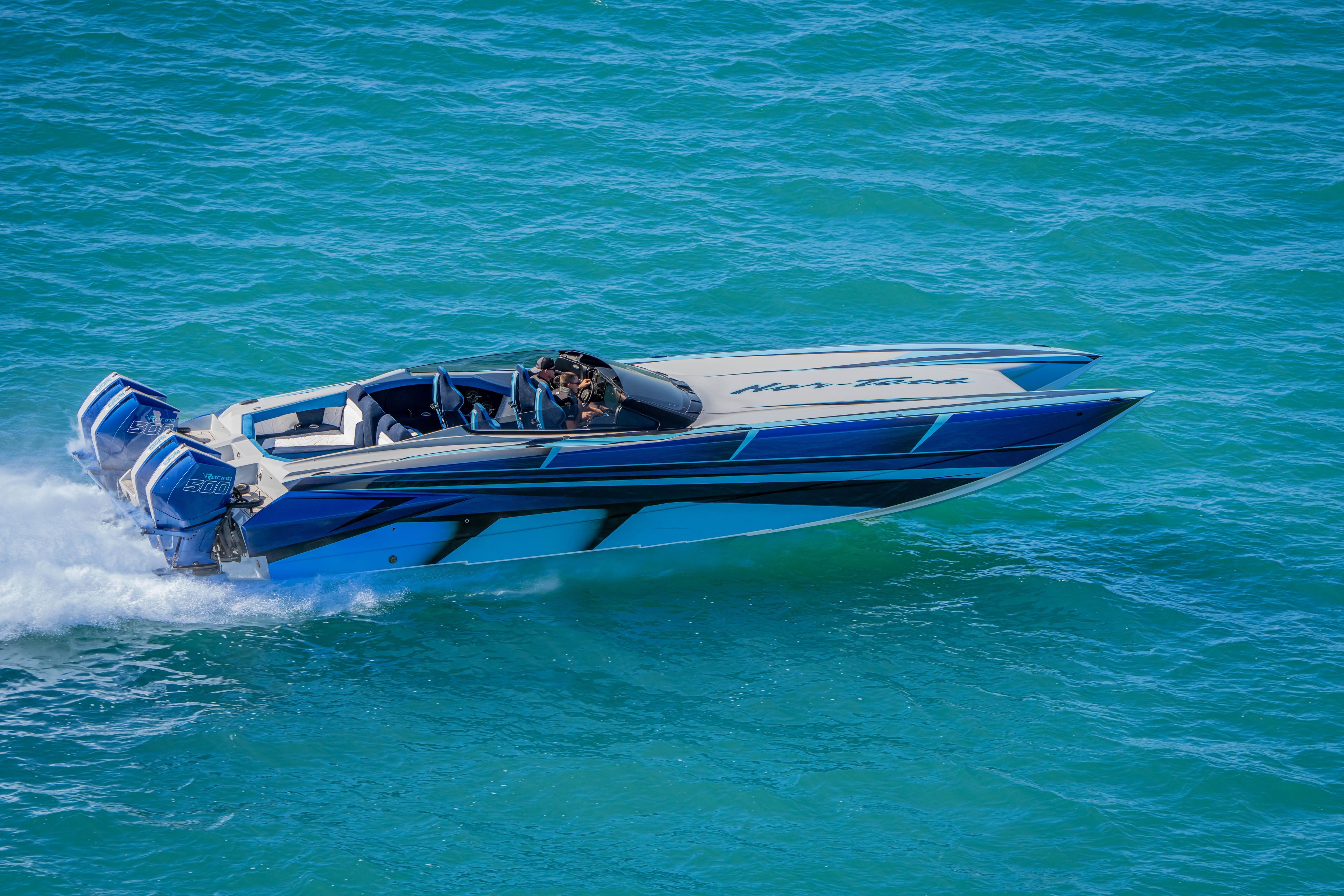 2026 Nor-Tech 4000 Super Catamaran speeding on blue ocean waters.