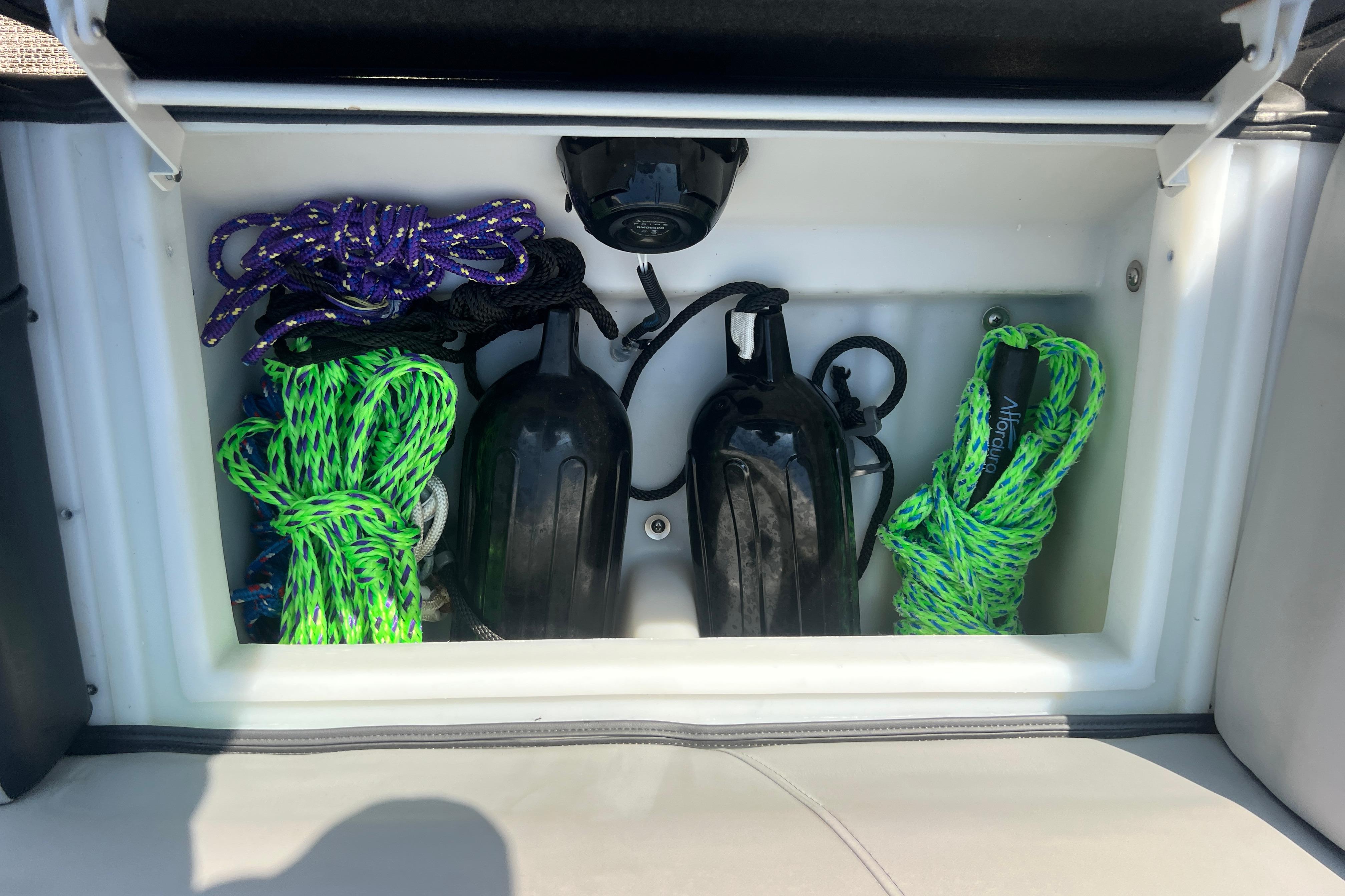 Storage compartment in 2022 Viaggio Lago V-U 22 boat with ropes and fenders.