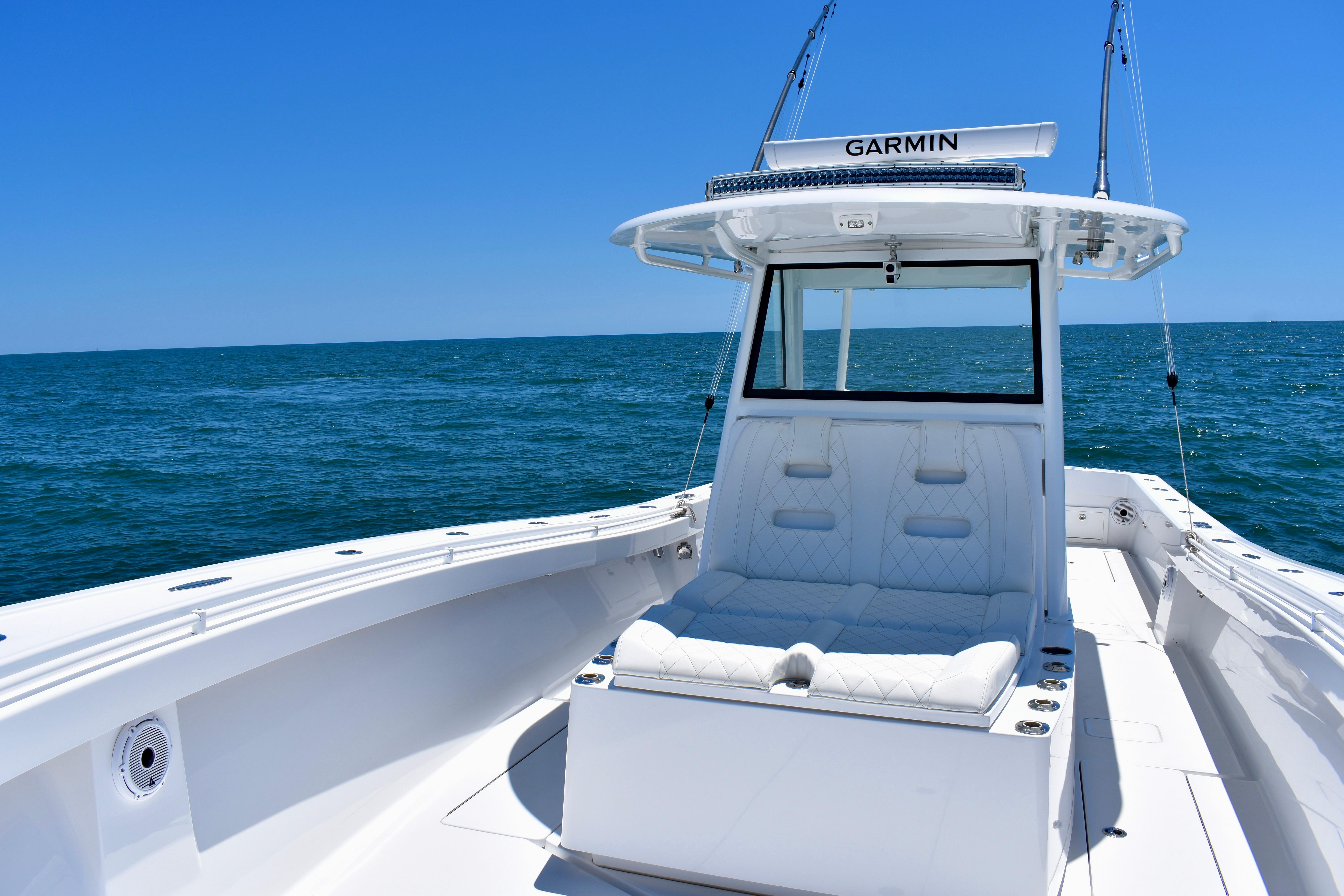 2022 Onslow Bay 41 Tournament boat on open sea, featuring sleek white design and Garmin equipment.