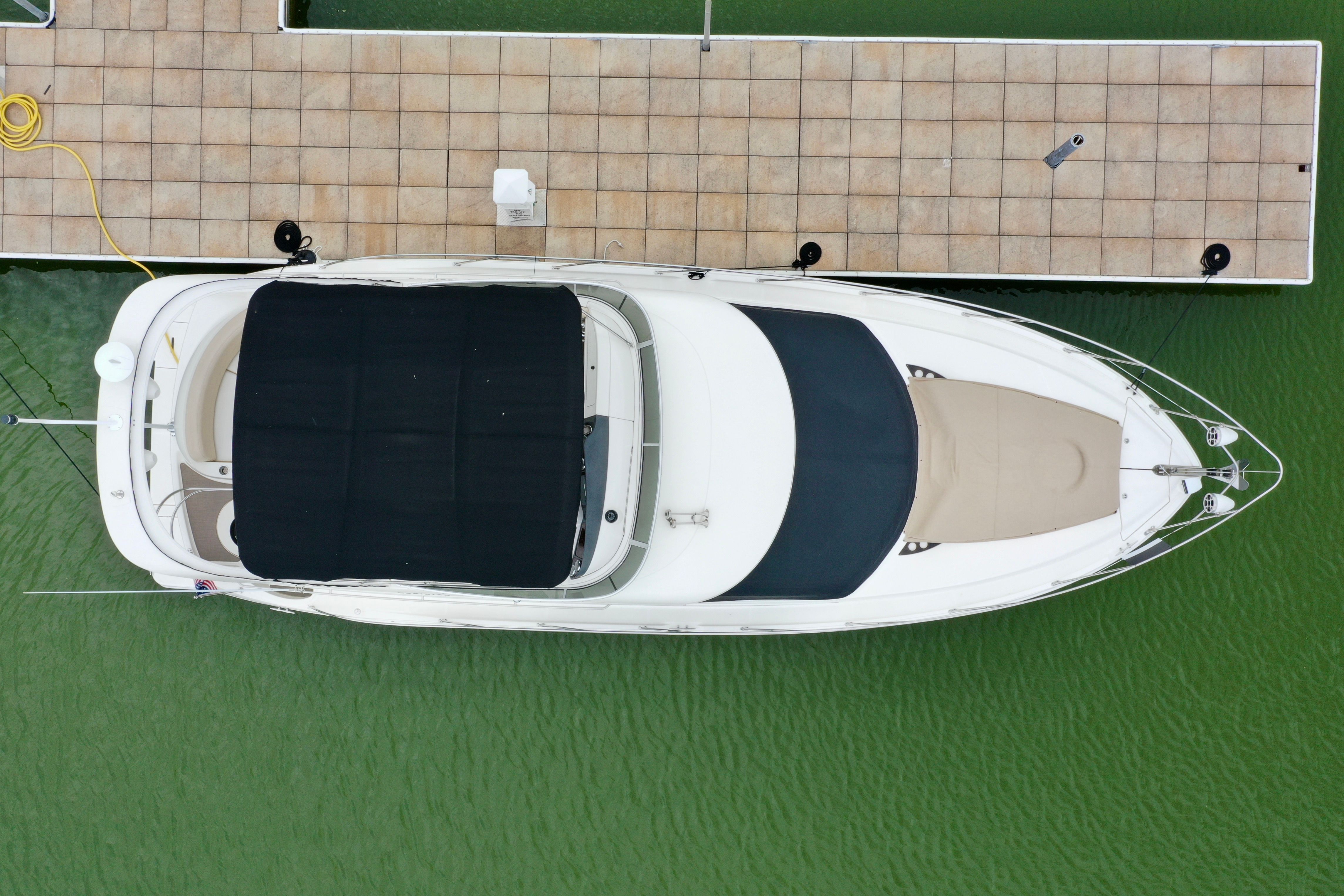 Aerial view of a Meridian 391 Sedan yacht docked.