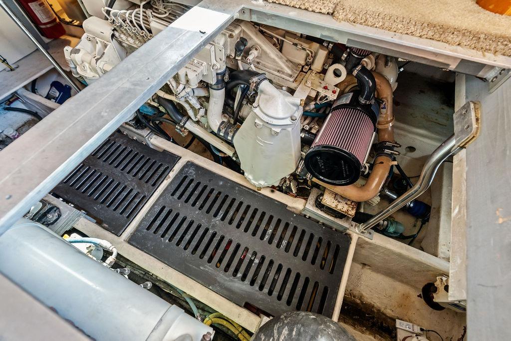 Engine compartment of a 2005 Luhrs 38 Convertible boat, showcasing mechanical components.