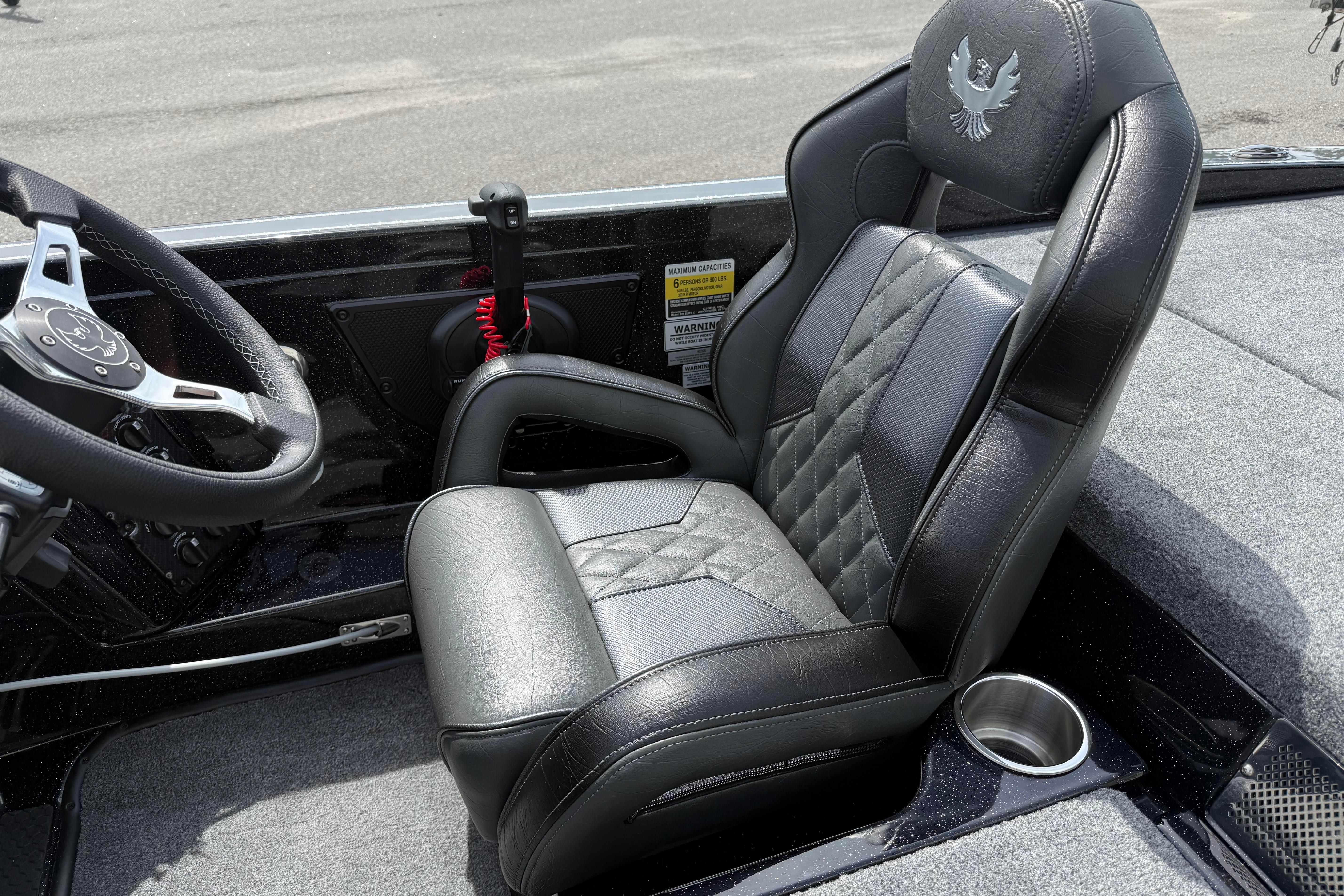 Luxury seating in 2027 Phoenix 921 Elite X boat with sleek black leather design.