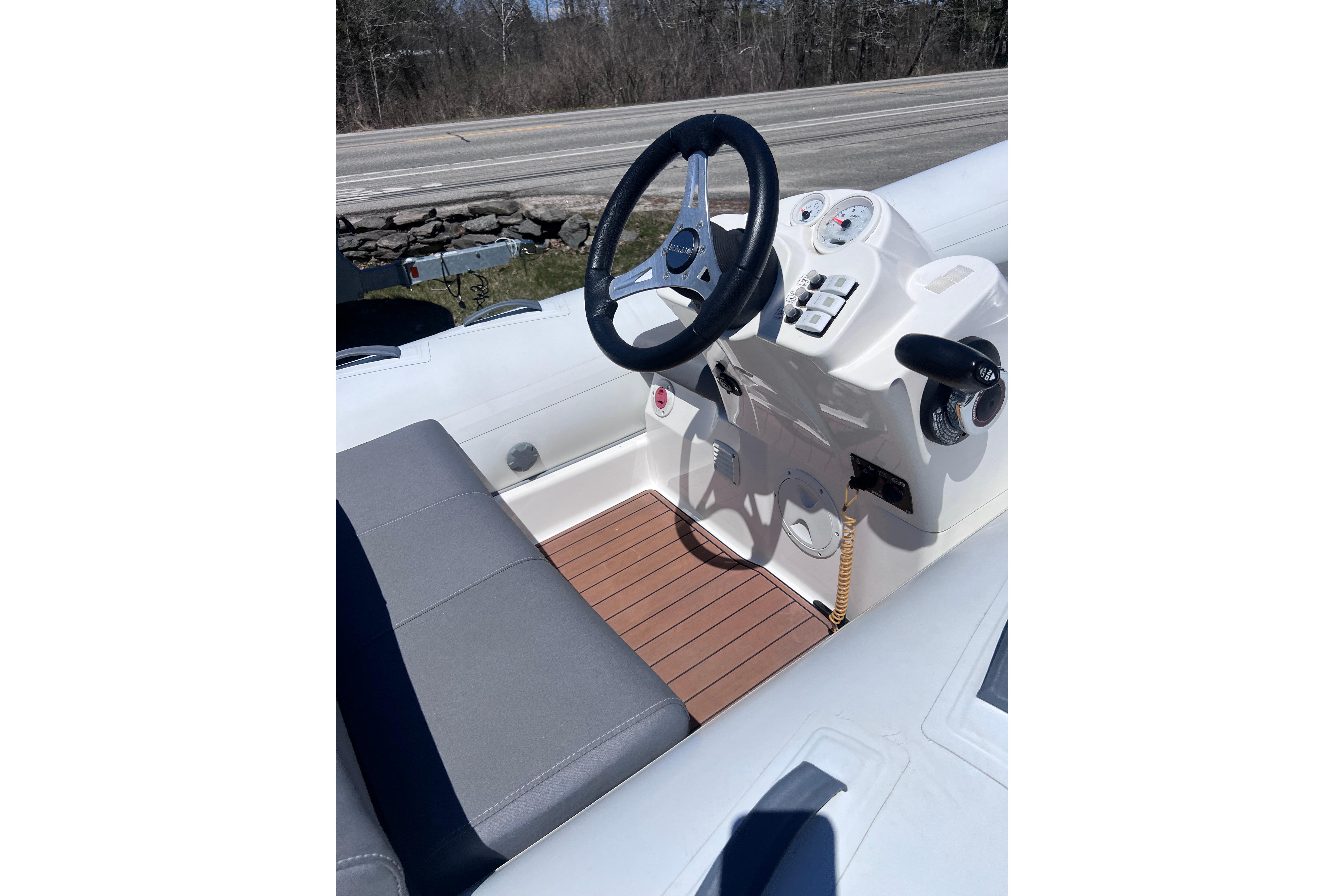 2016 Brig Eagle 340 boat interior with steering wheel and control panel.