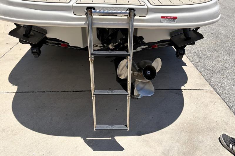 Rear view of 2007 Sea Ray 240 Sundeck with ladder and propeller.