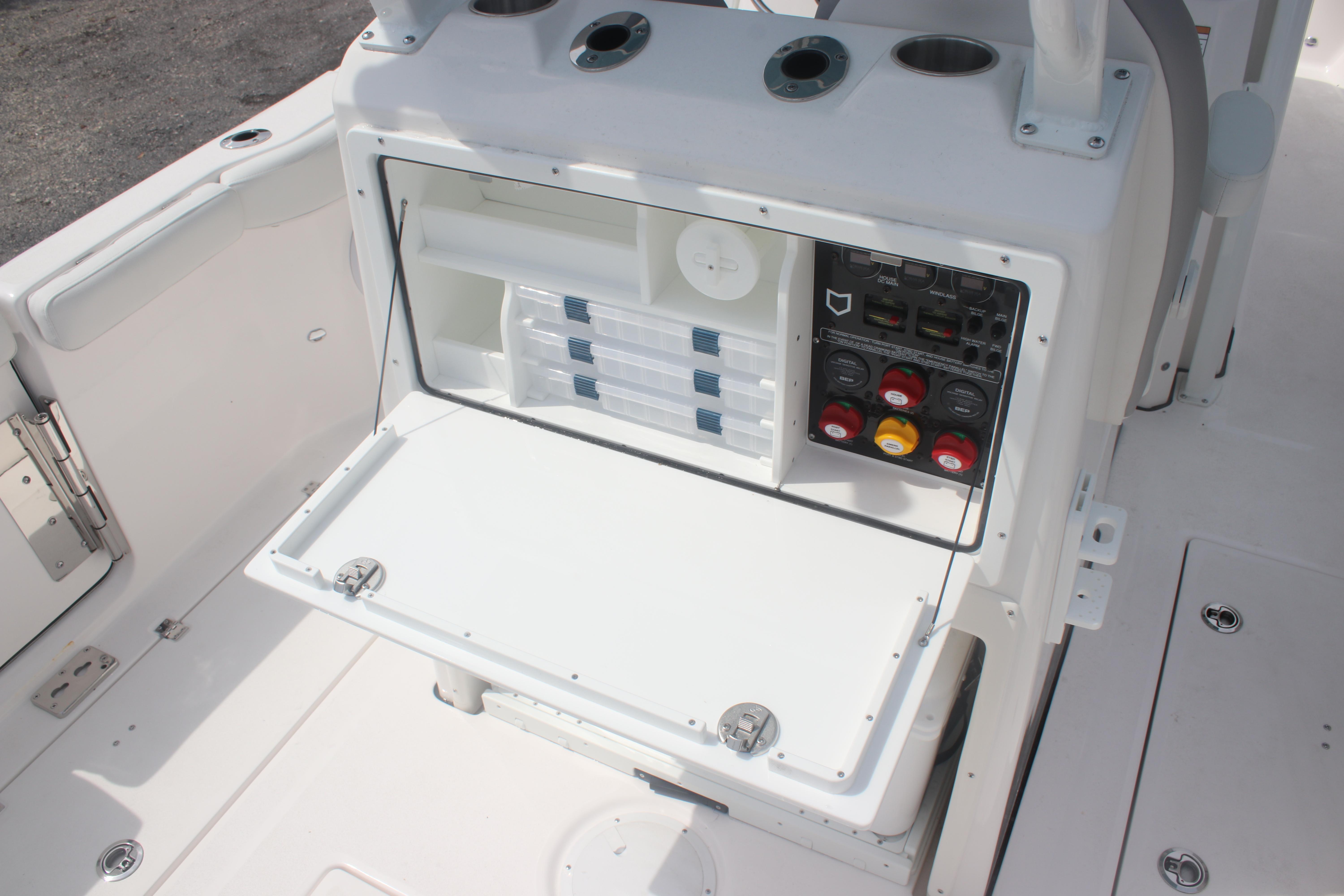 2026 Sea Fox 288 Commander boat storage and control panel area.