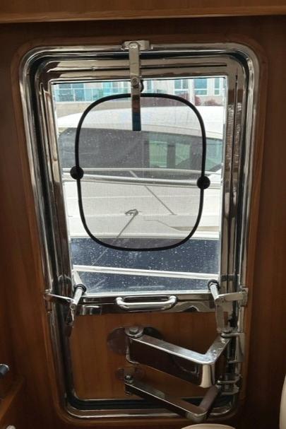 Bracewell 41 yacht window, 2025 model, with secure locking mechanism and exterior view.