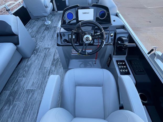Interior of 2025 Landau Atlantis 23C Cruise with steering console.