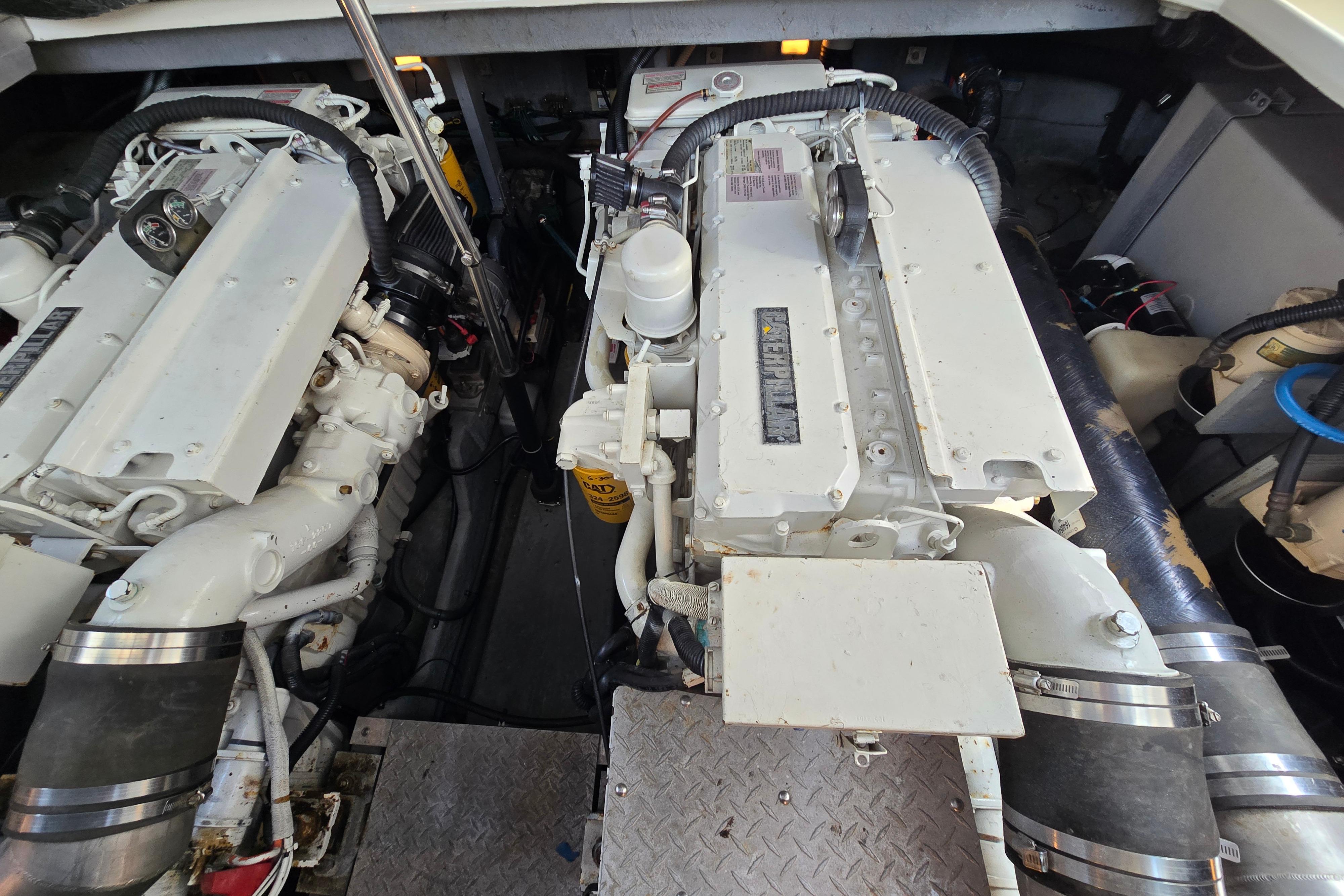 Engine room of a 1999 Sea Ray Sundancer 400, showcasing dual marine engines.