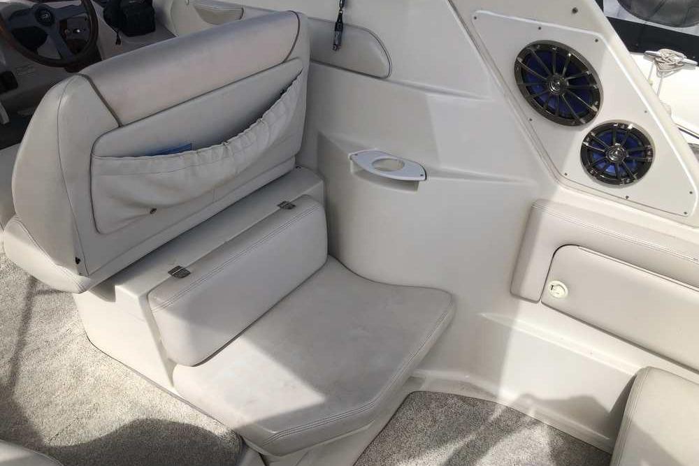 1999 Regal Commodore 2760 boat interior with seating and speakers.