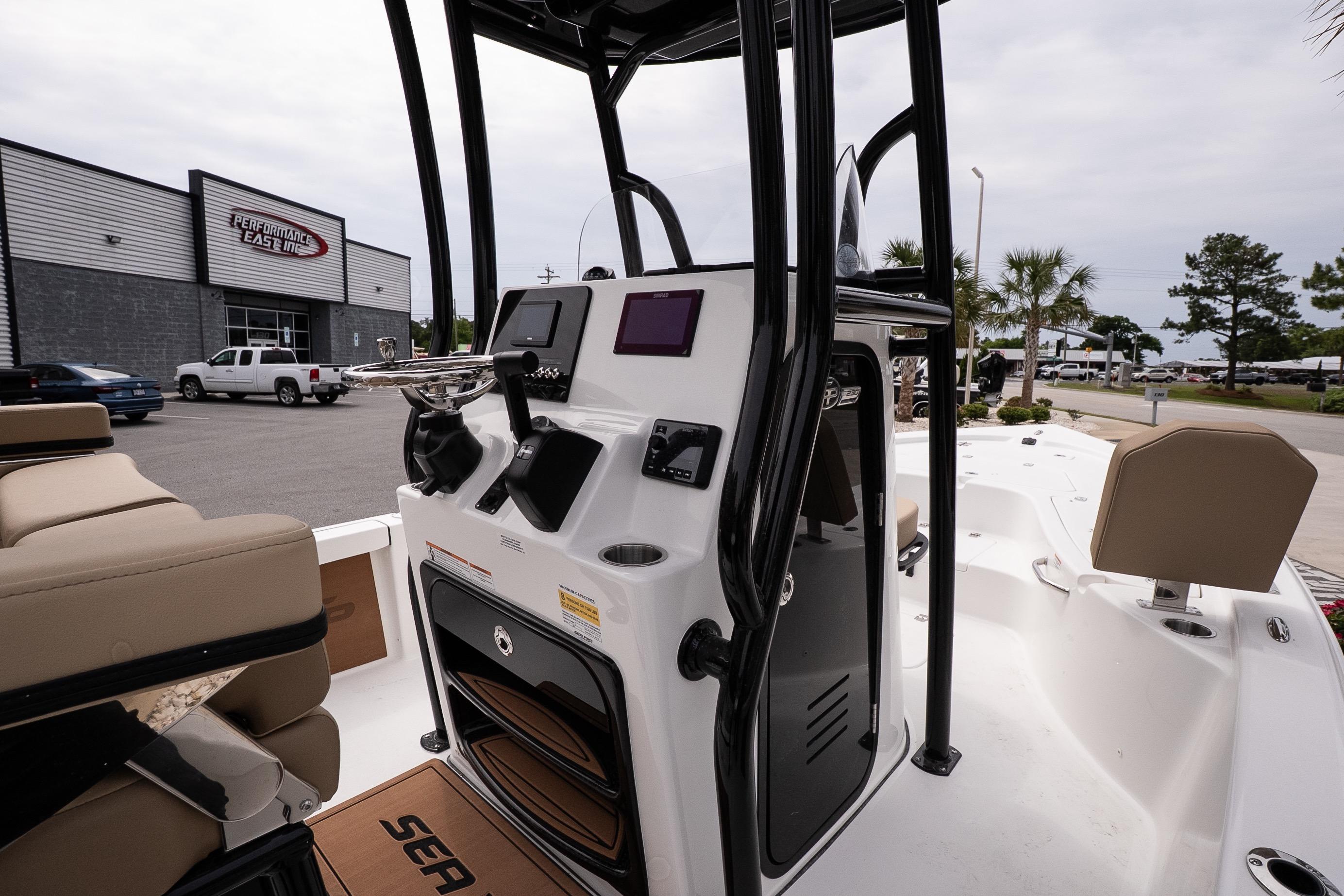 2026 Sea Pro 230 Bay boat interior with modern console and seating at dealership.