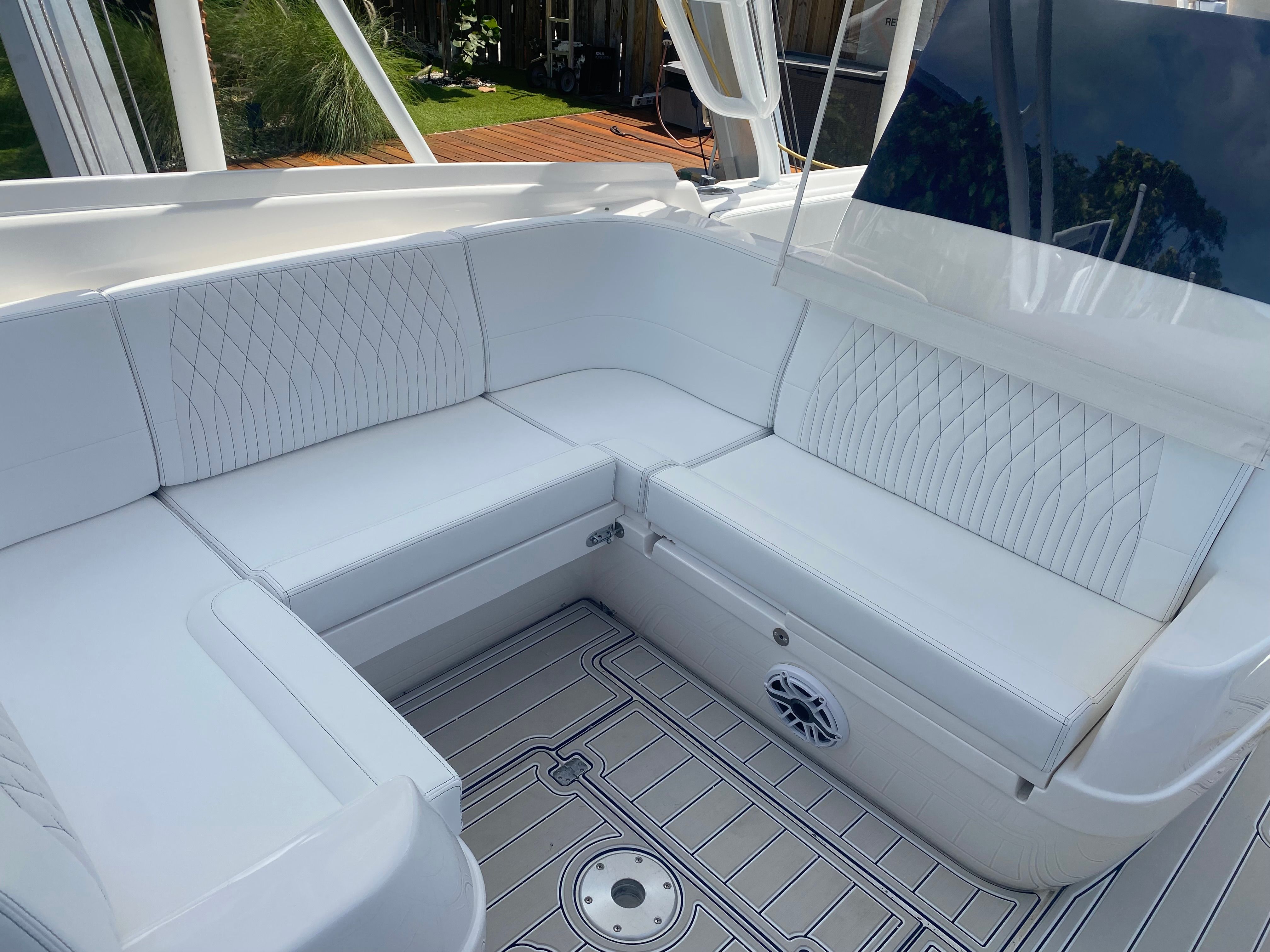 The 2011 Intrepid 37 features a luxurious white seating area with elegant stitching.