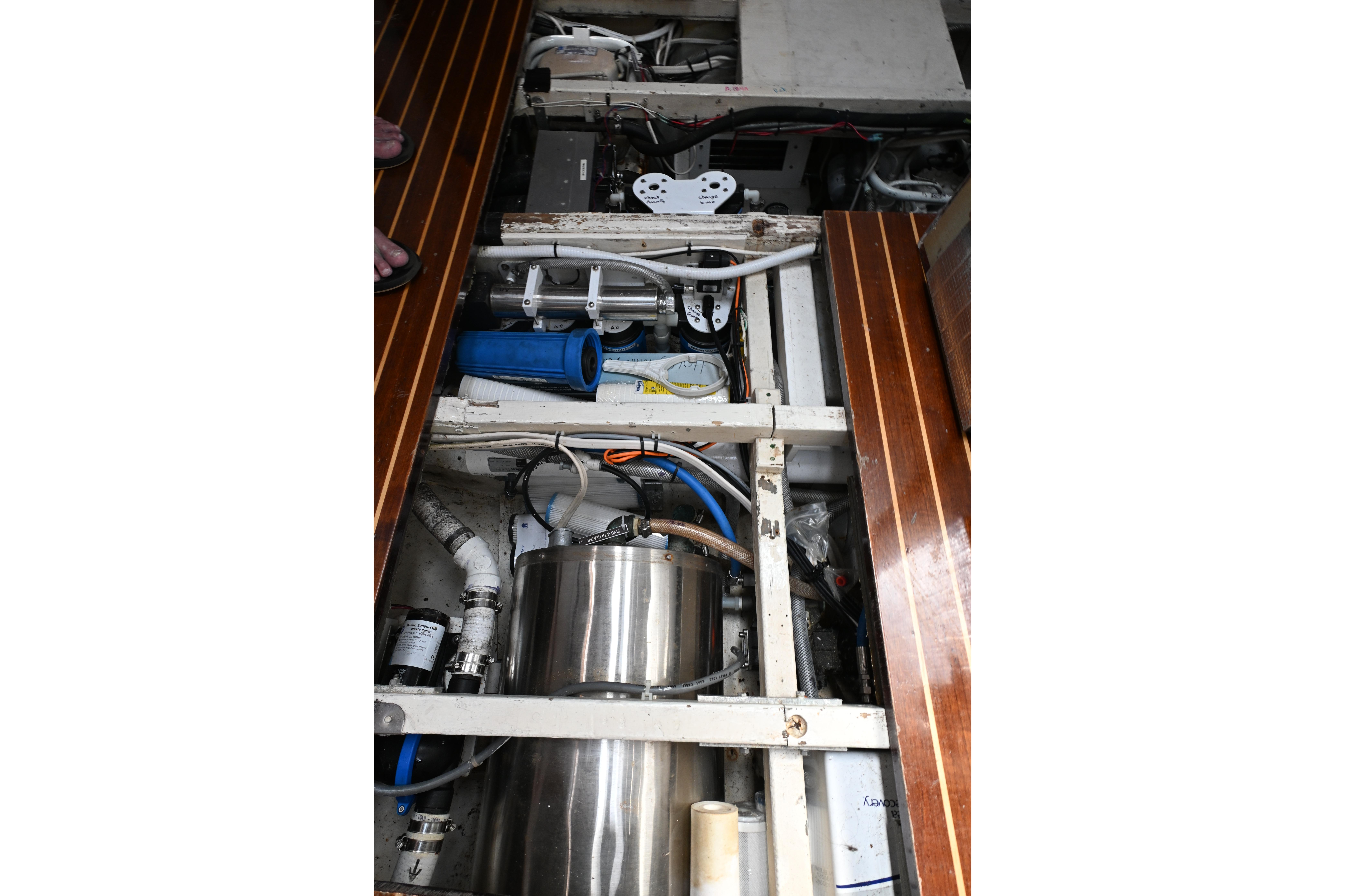 Engine room of a 1968 Abeking & Rasmussen Tripp 74 yacht, showcasing mechanical components.