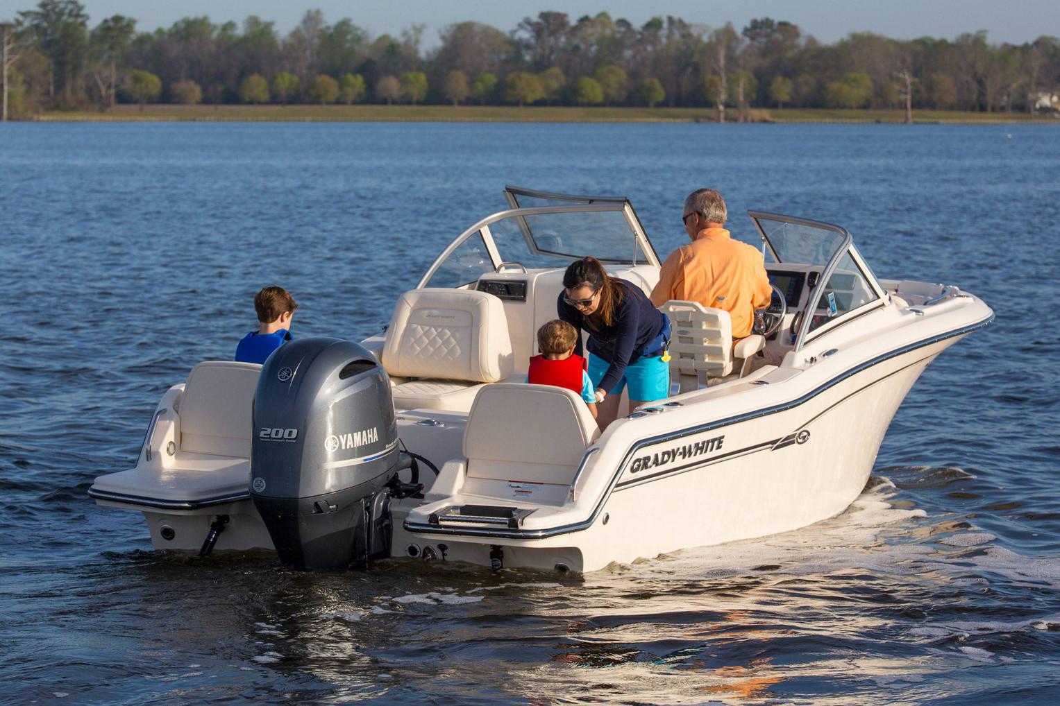 Manufacturer Provided Image: 2019 Grady-White Freedom 215 boat on water with family onboard.